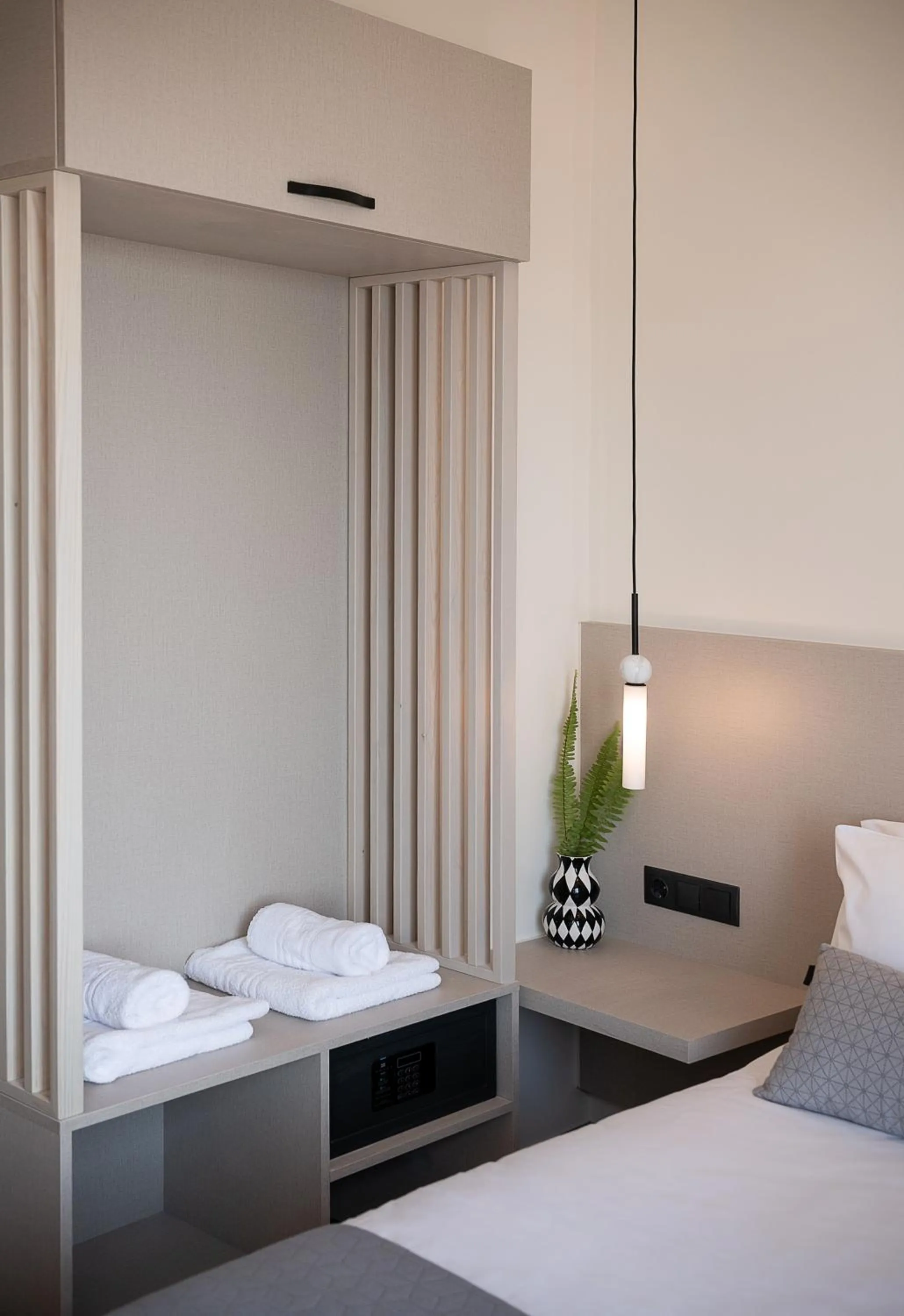 Bed in Amphitrite Hotel