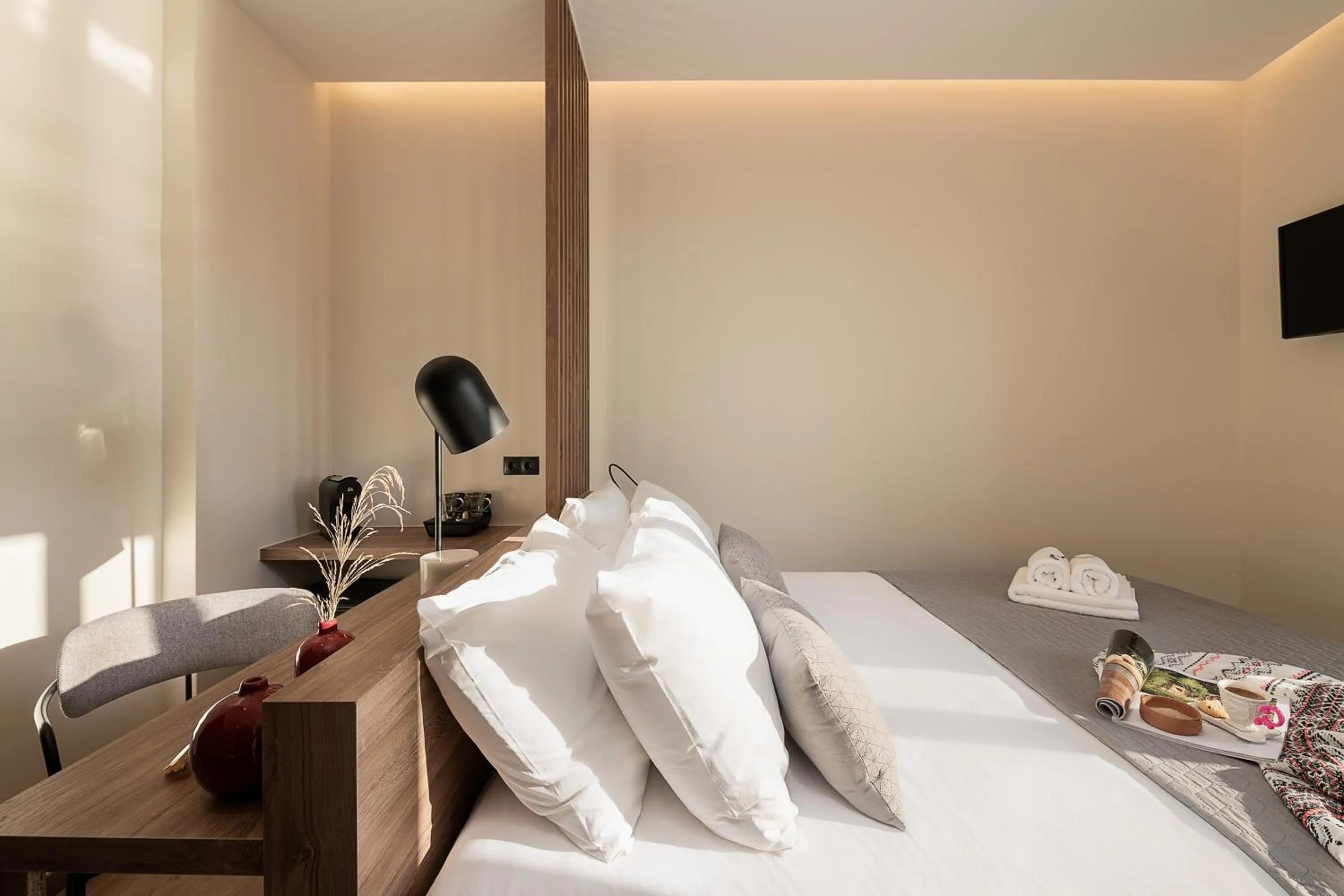 Bed in Amphitrite Hotel