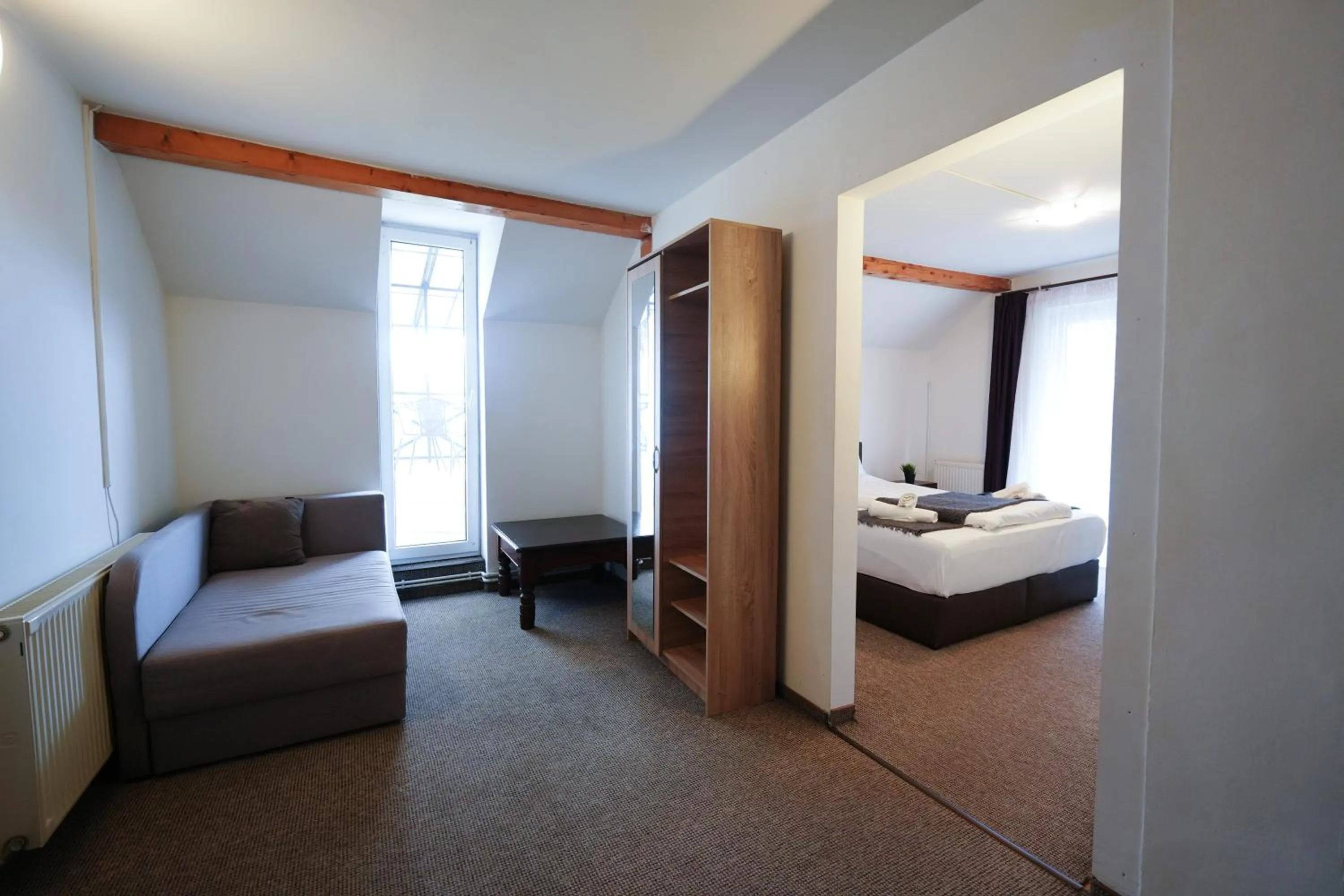 Seating area, Bed in Gasthof Sara