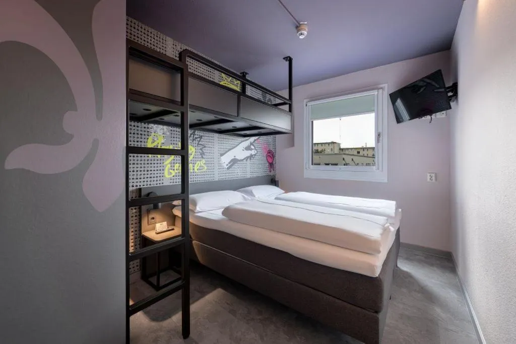 Bed in Felix Hotel Darmstadt