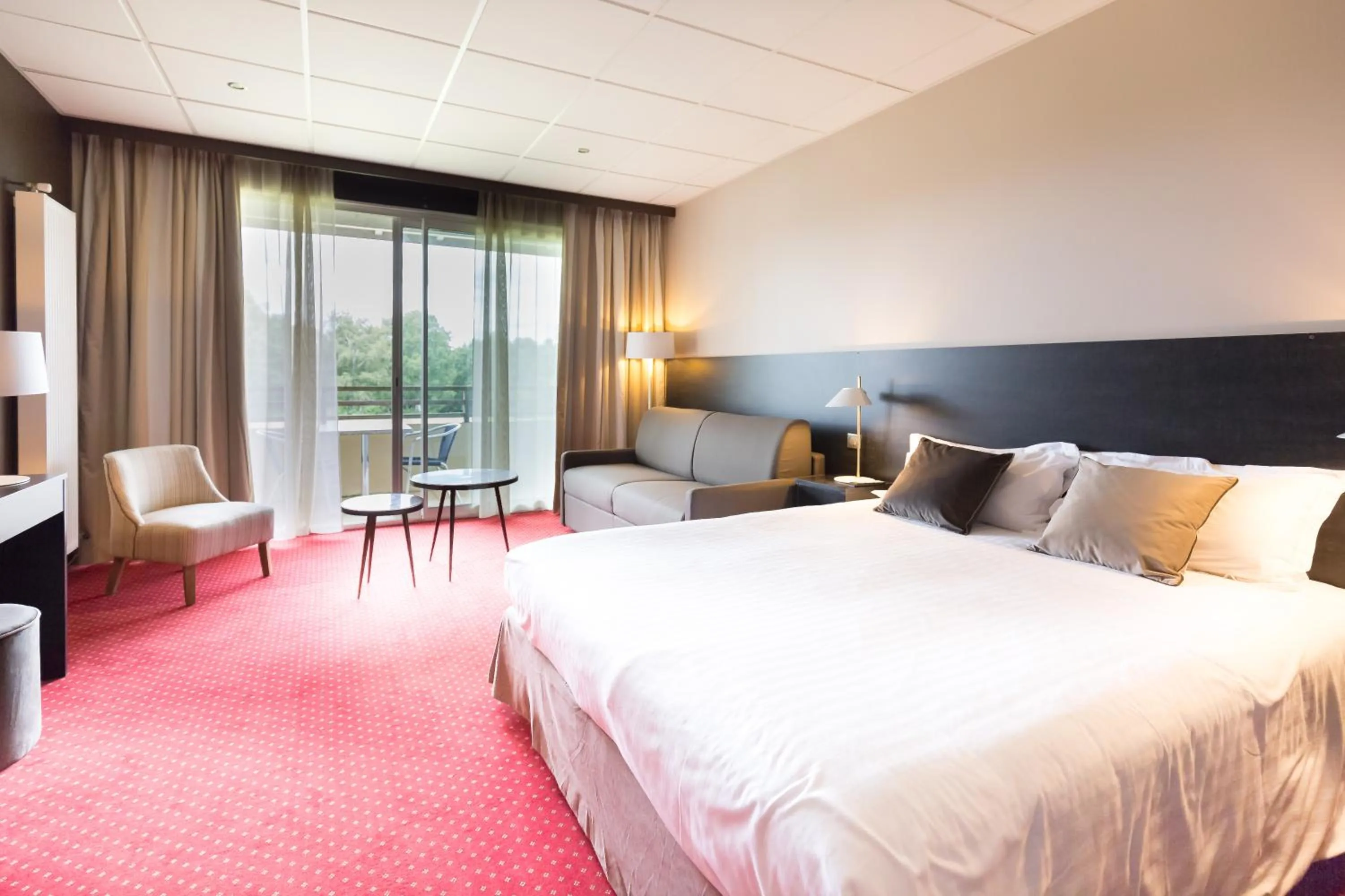 Photo of the whole room, Bed in Hôtel du Casino de Capvern