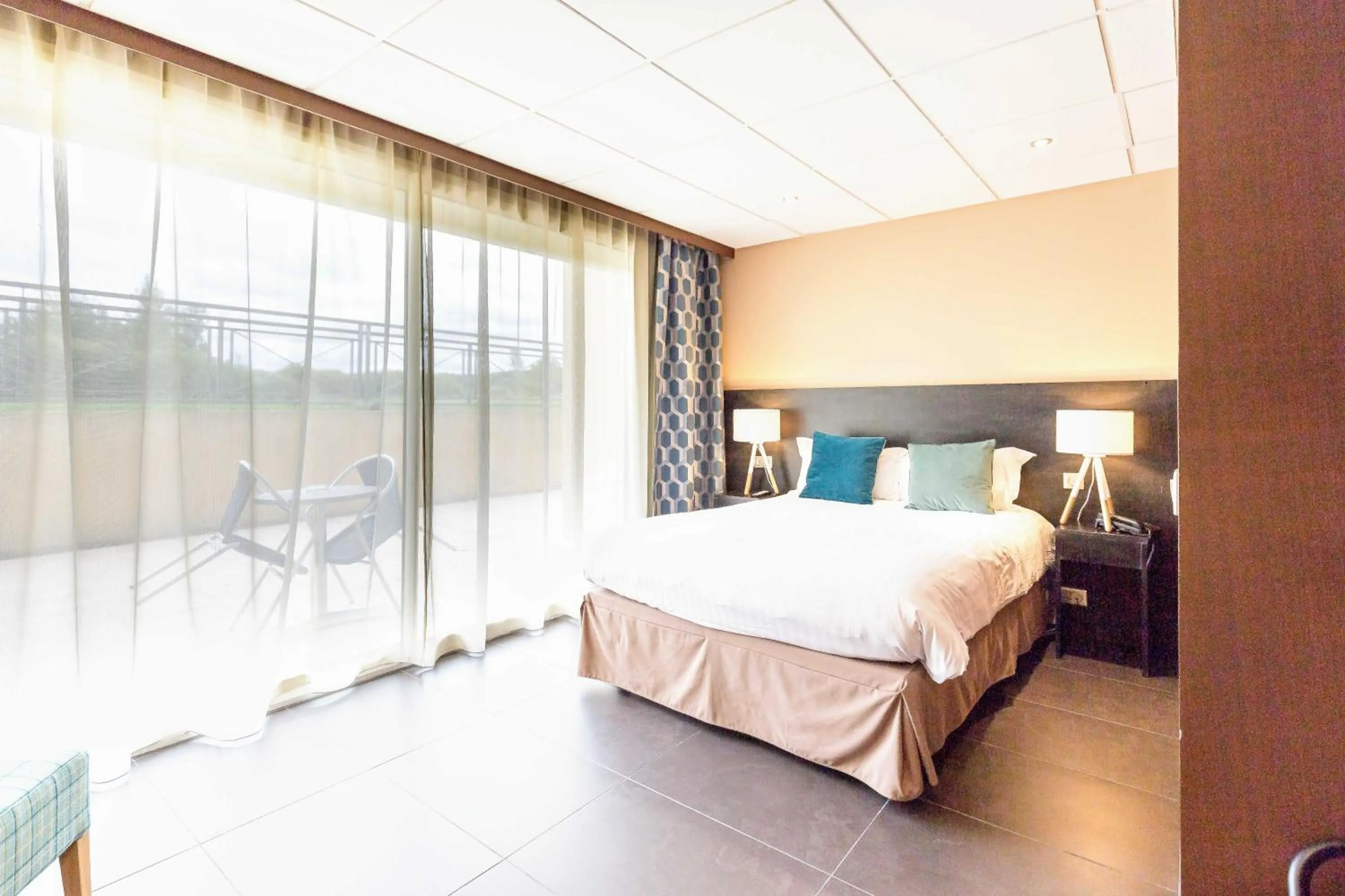 Photo of the whole room, Bed in Hôtel du Casino de Capvern