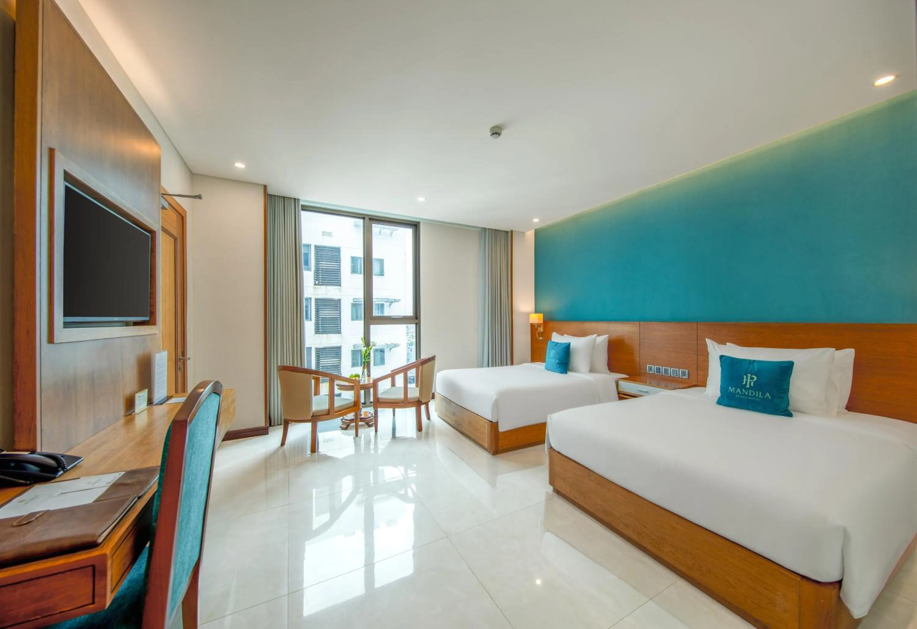 Photo of the whole room, Bed in Mandila Beach Hotel Danang