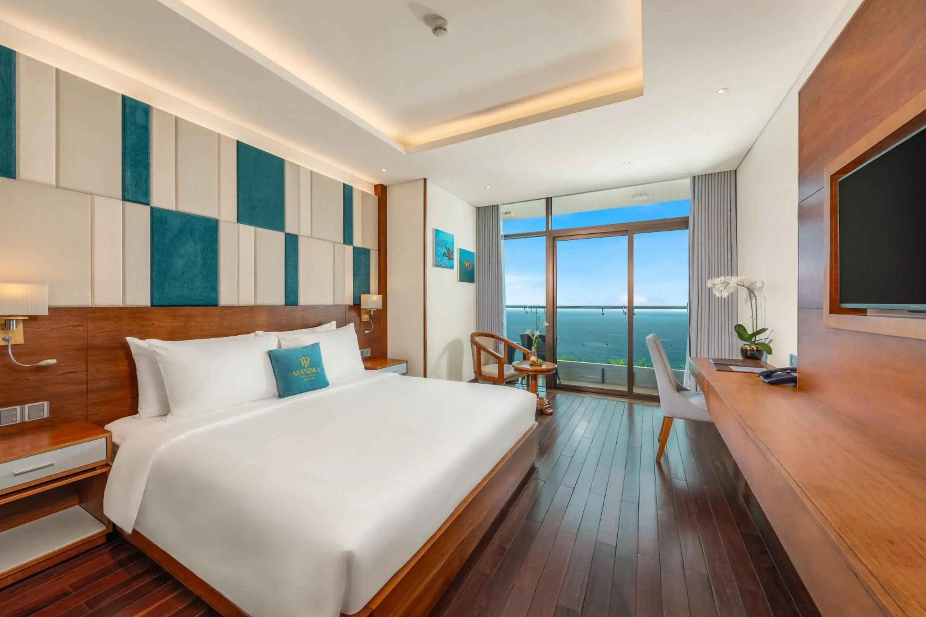 Balcony/Terrace, Bed in Mandila Beach Hotel Danang Balcony/Terrace, Bed in Mandila Beach Hotel Danang