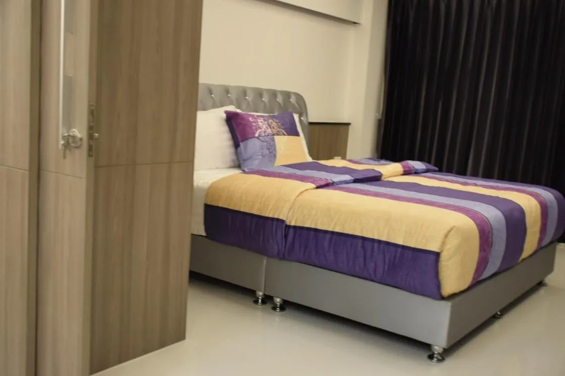 Bed in Family Suite Room Pratunam