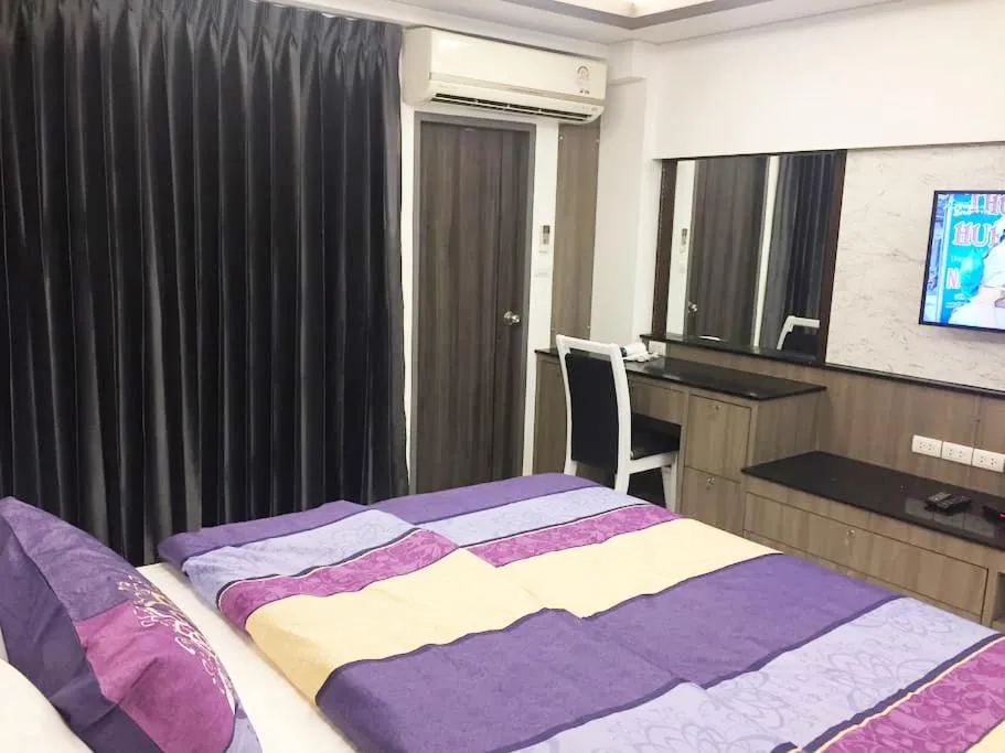 Property building, Bed in Family Suite Room Pratunam