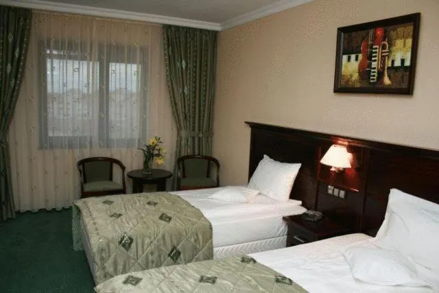 Bed in Hotel Rapsodia City Center