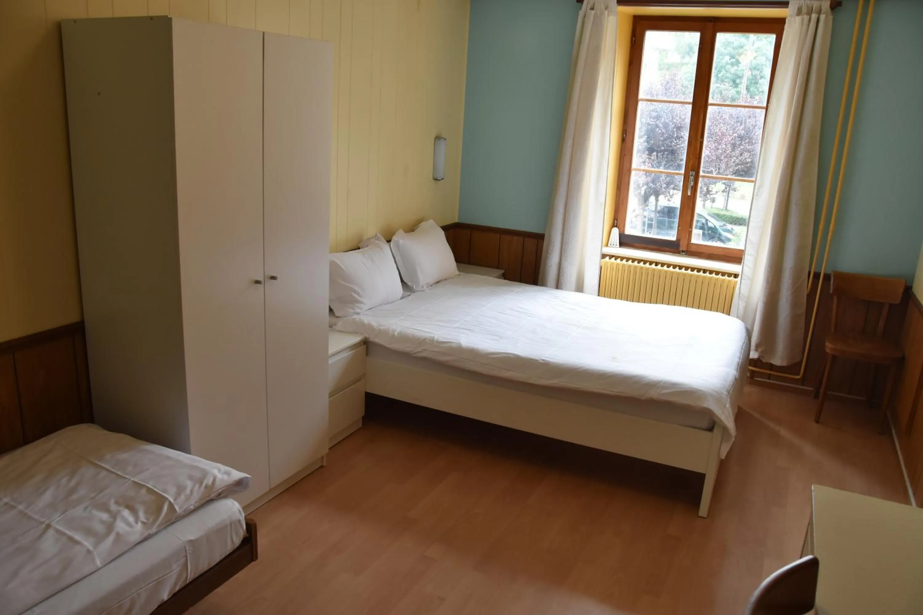 Bed in Hôtel de l'ours