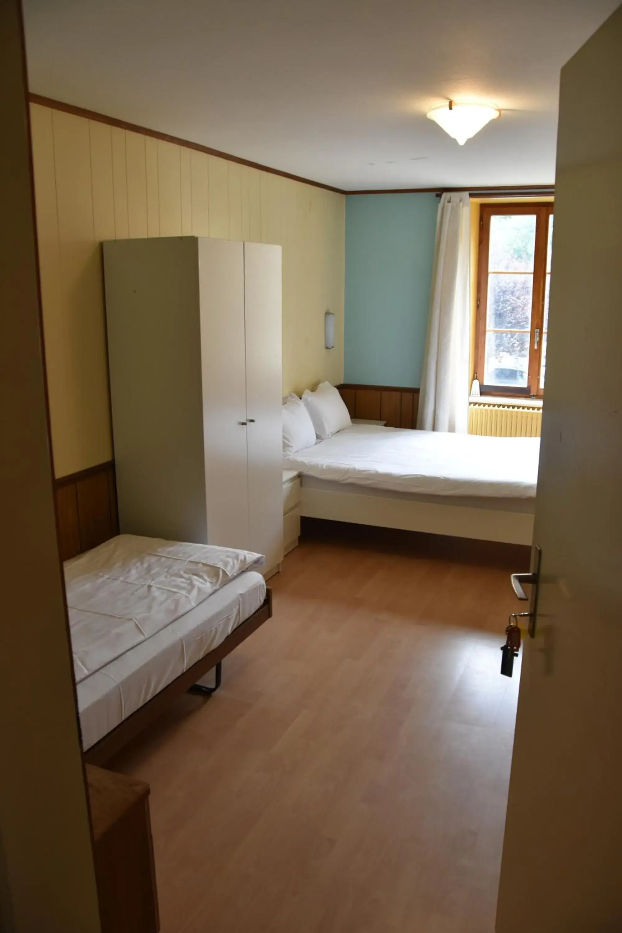 Triple Room with Private External Bathroom - single occupancy in Hôtel de l'ours Triple Room with Private External Bathroom - single occupancy in Hôtel de l'ours