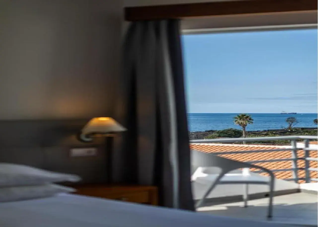 View (from property/room), Bed in Hotel Arcanjo View (from property/room), Bed in Hotel Arcanjo