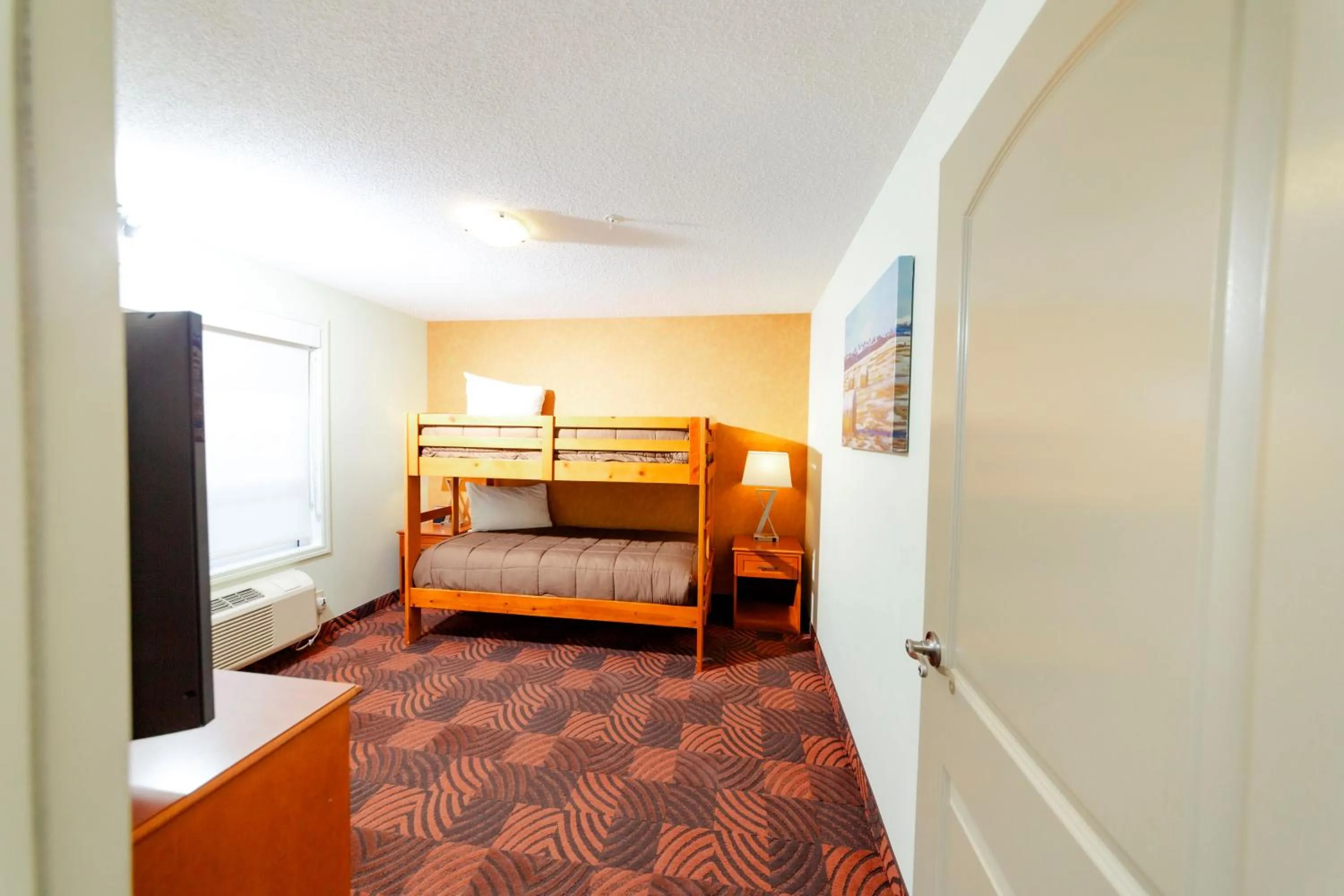 cot, Bed in Service Plus Inns and Suites Calgary