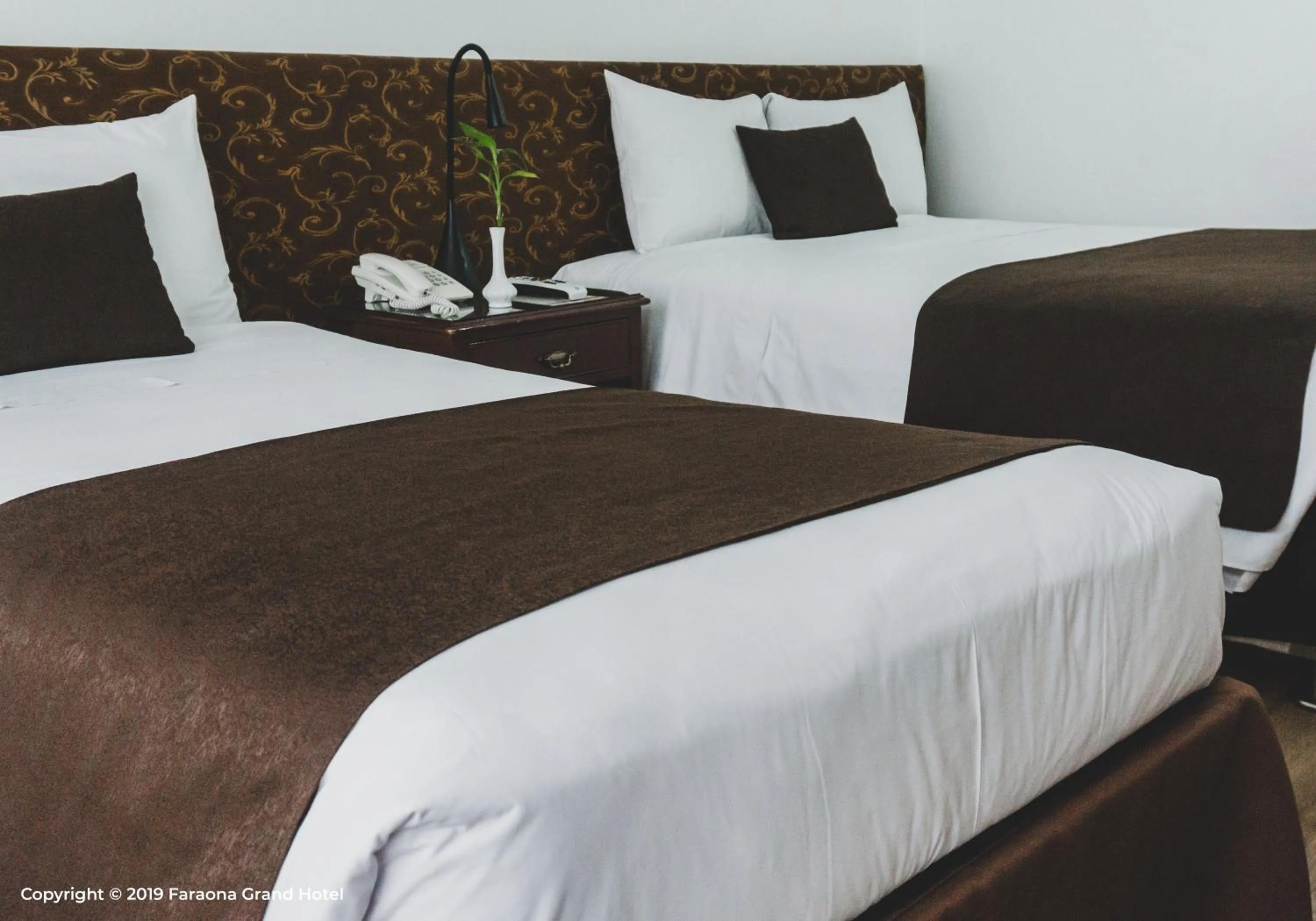 Bed in Faraona Grand Hotel