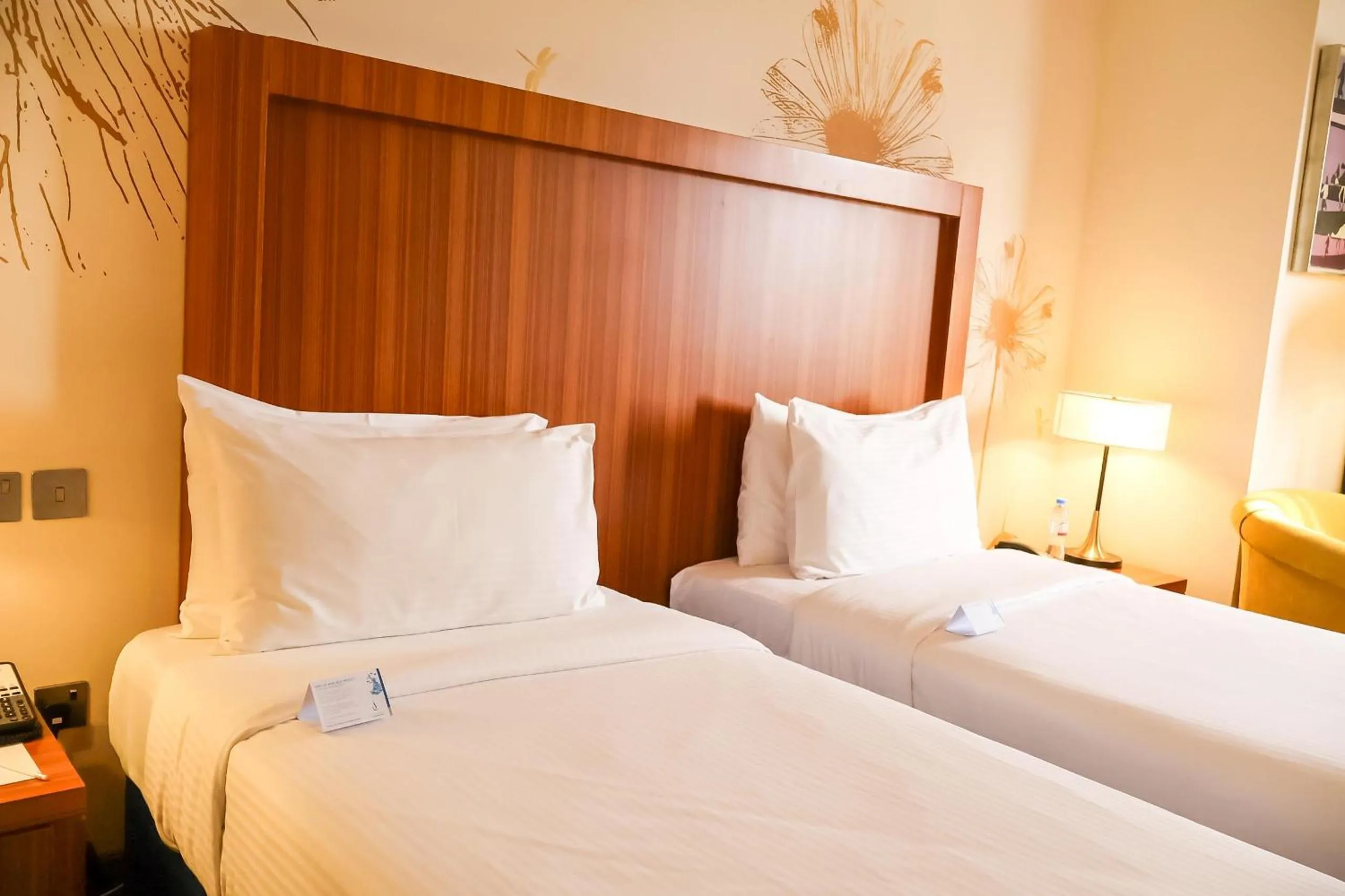 Bed in City Seasons Al Hamra Hotel