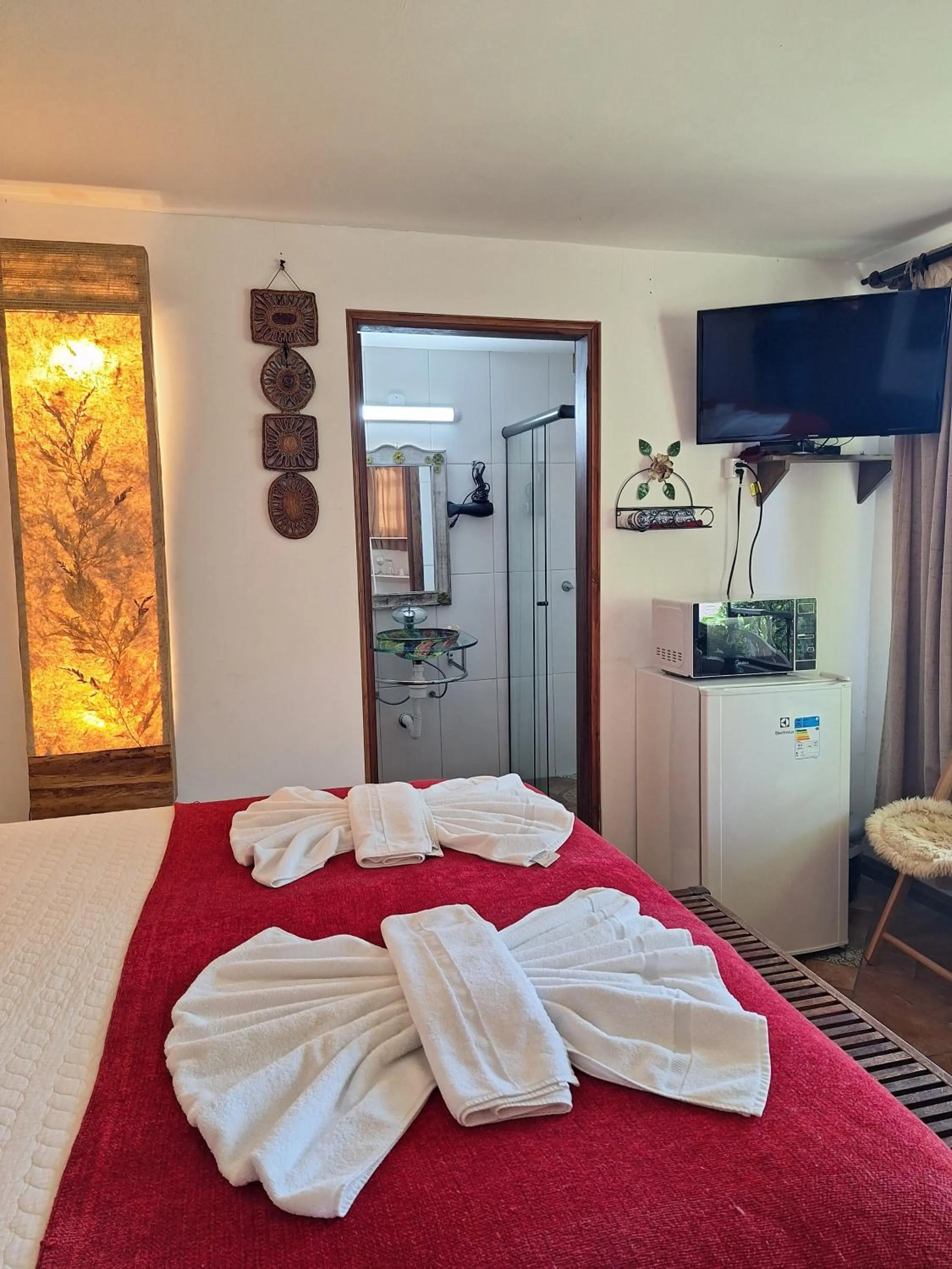 towels, Bed in Chalés ANECUEM