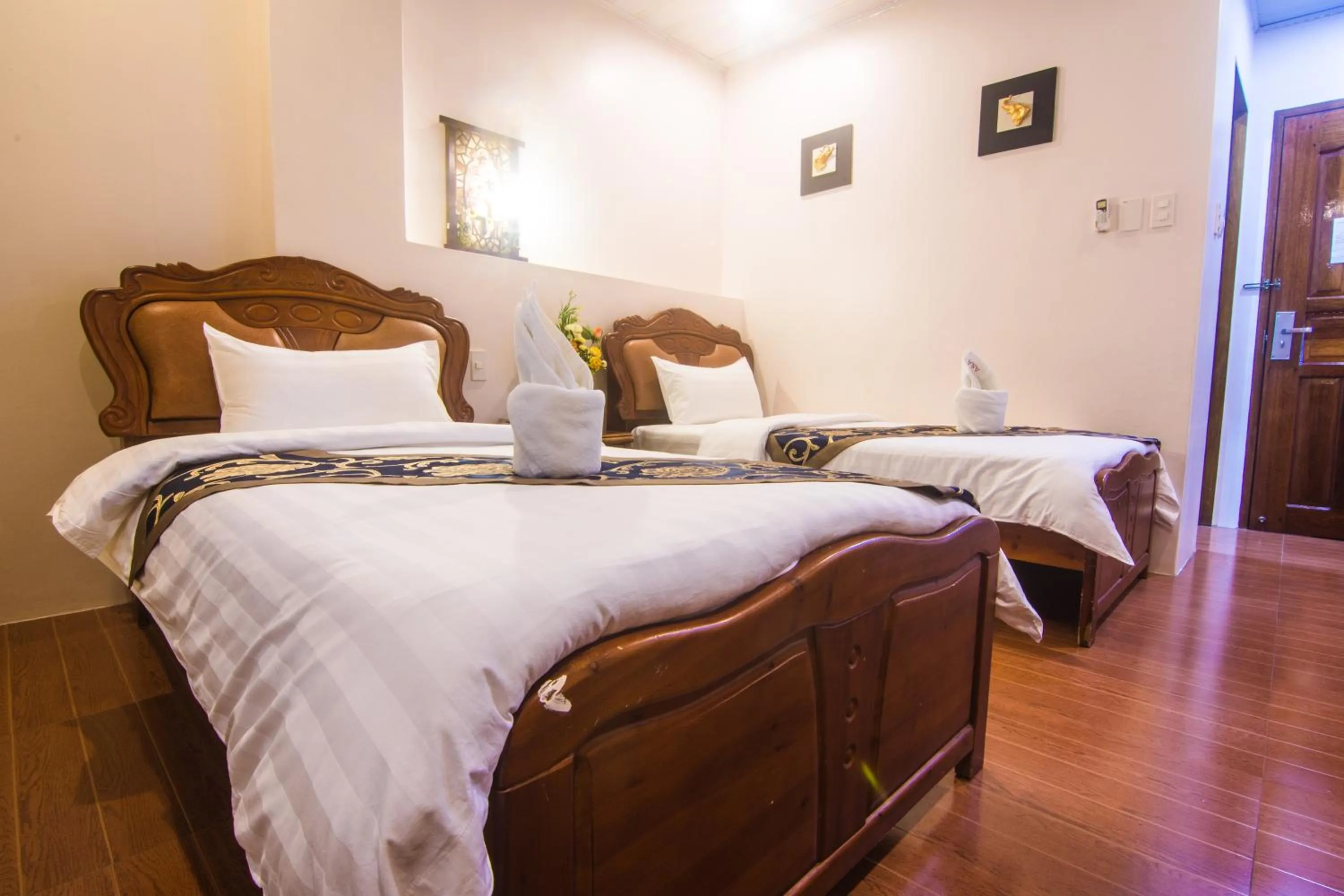 Bed in A&A Plaza Hotel