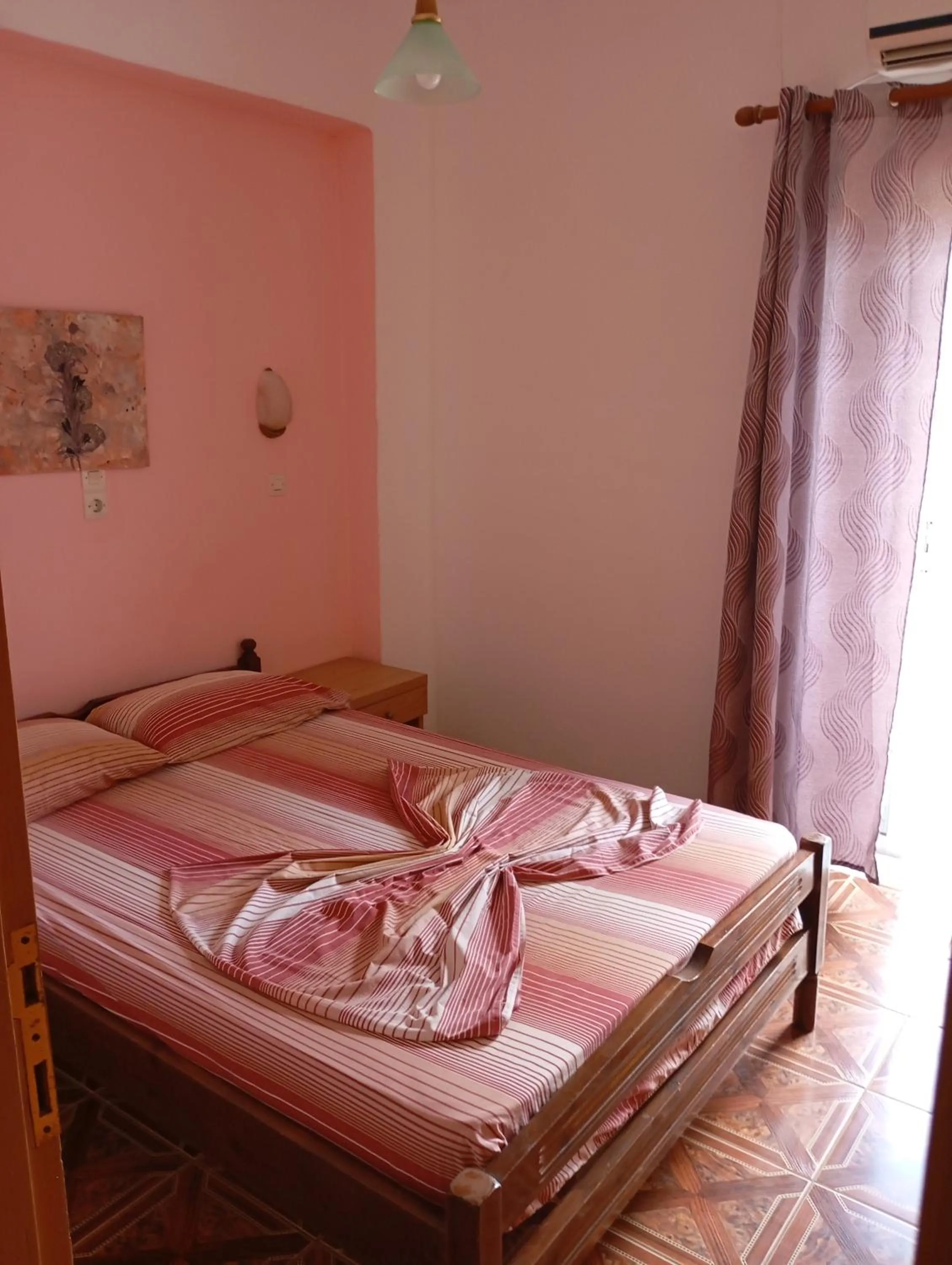 Bed in Denise Apartments Kefalos