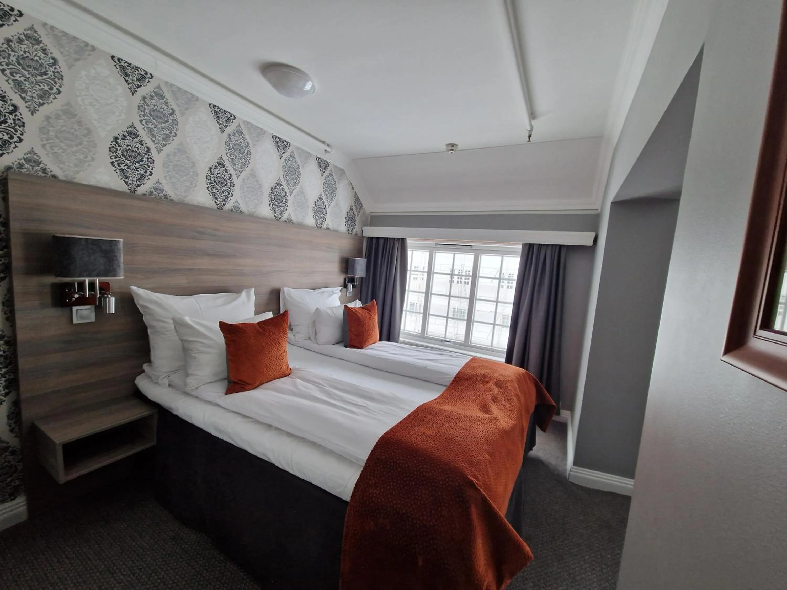 Bed in Dr. Holms Hotel