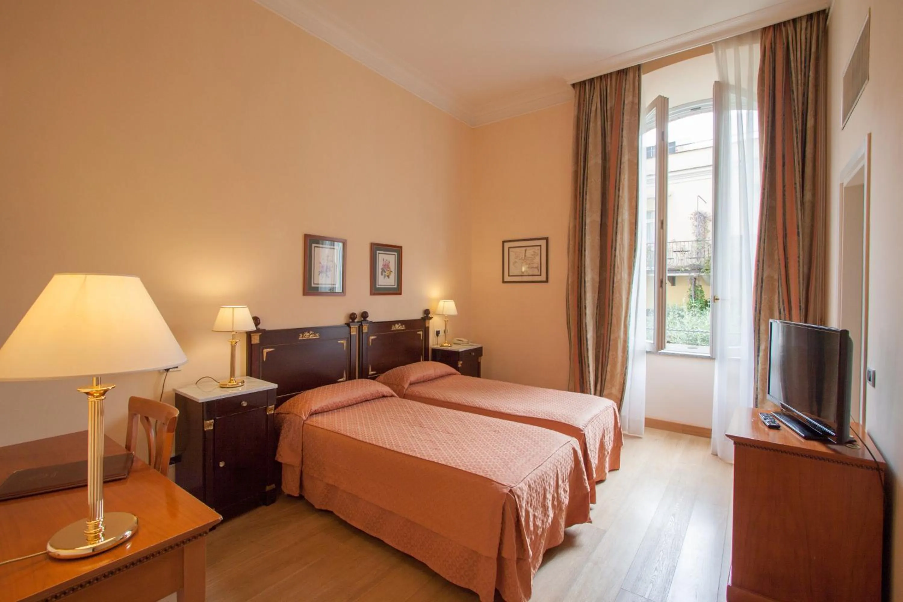 Photo of the whole room, Bed in Ateneo Garden Palace