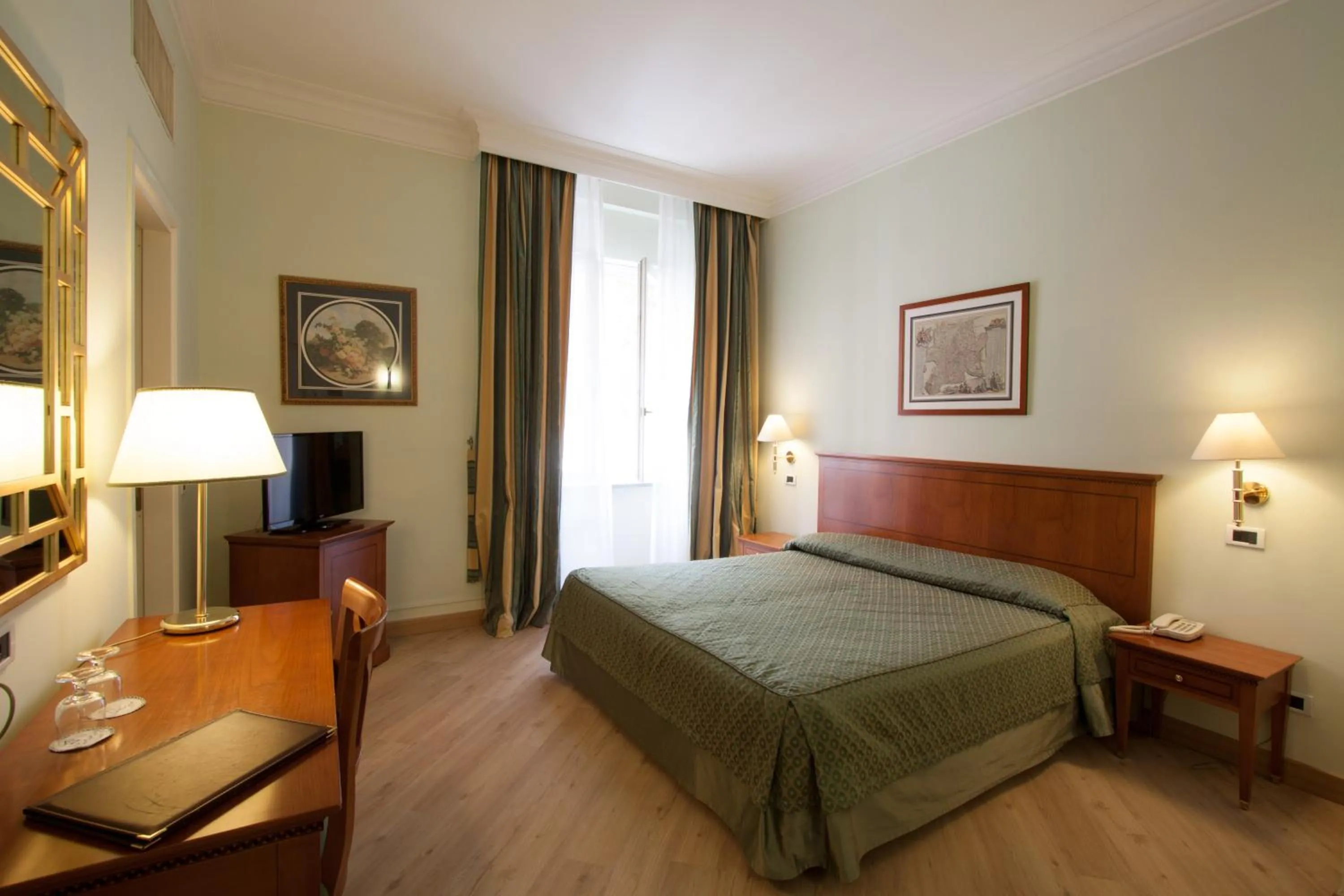 Photo of the whole room, Bed in Ateneo Garden Palace