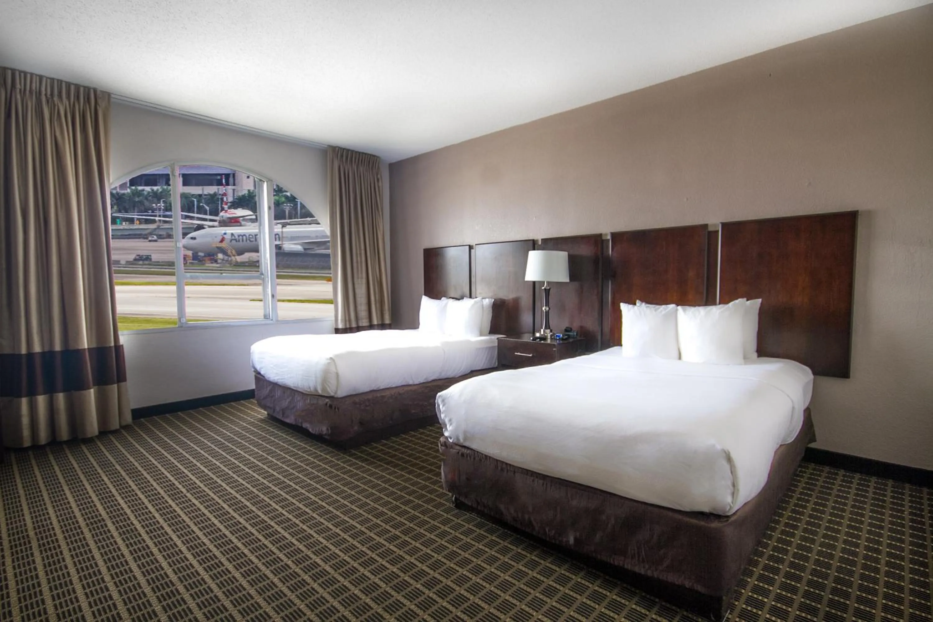 Bed in Clarion Inn & Suites Miami International Airport