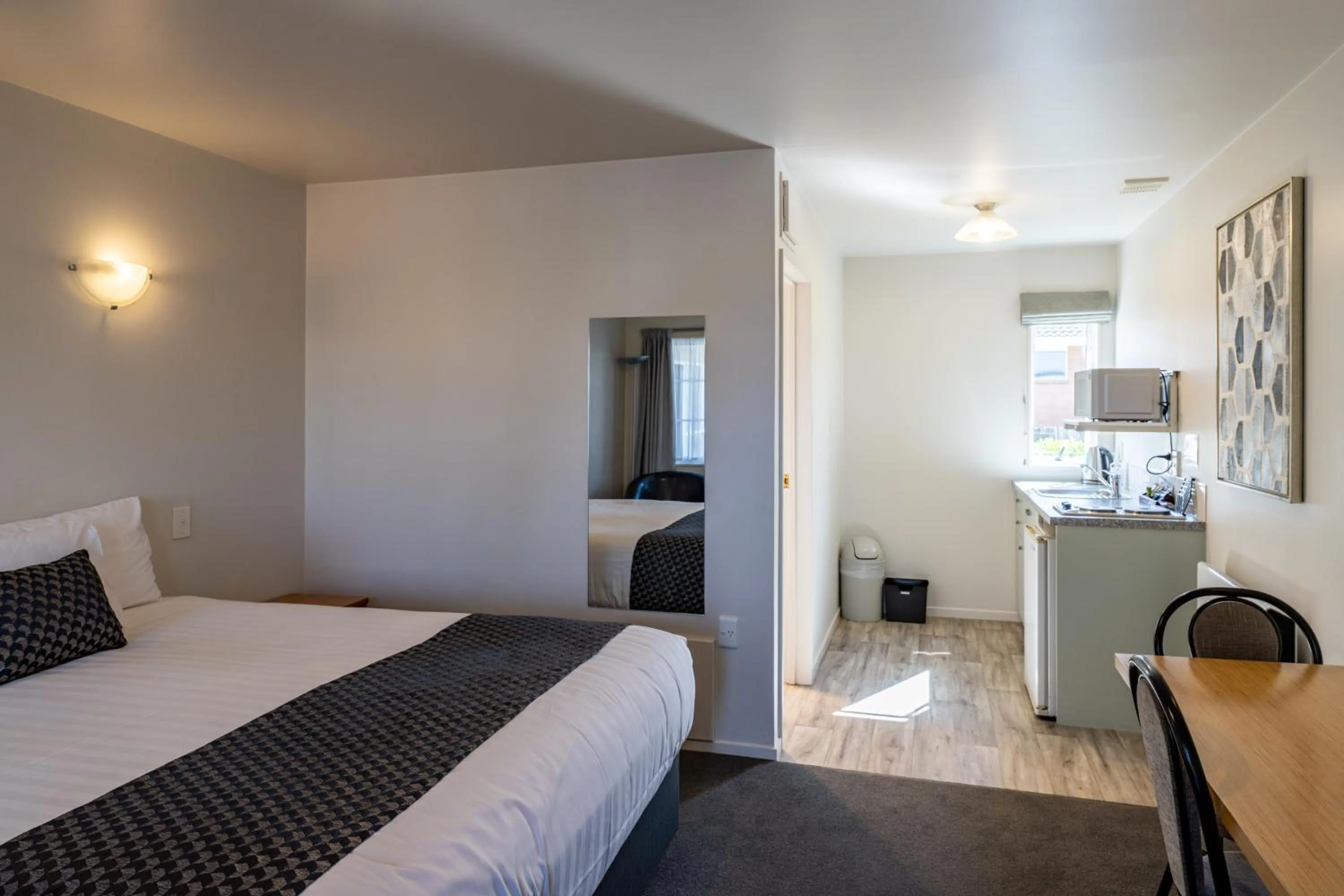 Bed in ASURE Gables Motor Lodge