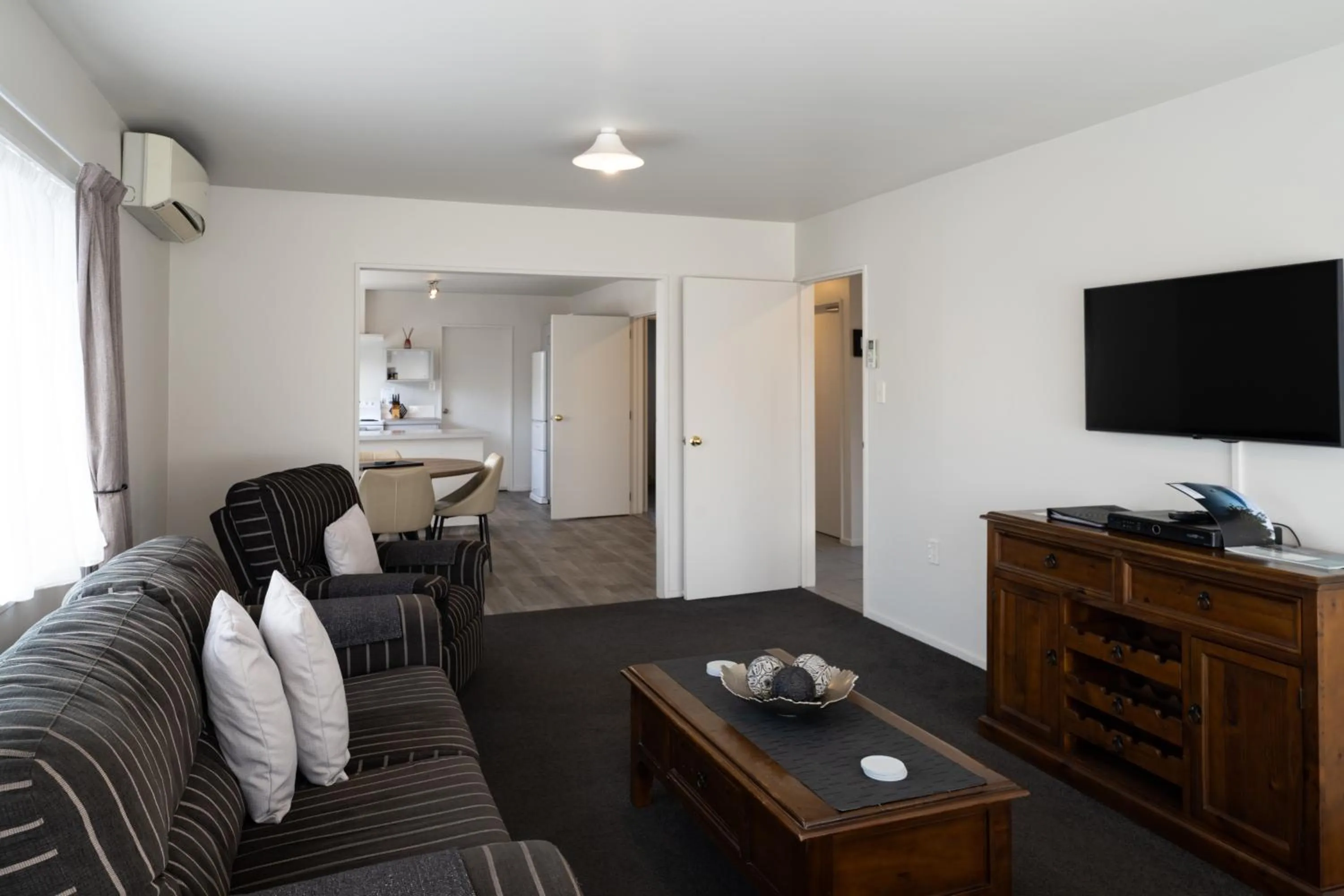 Seating area in ASURE Gables Motor Lodge