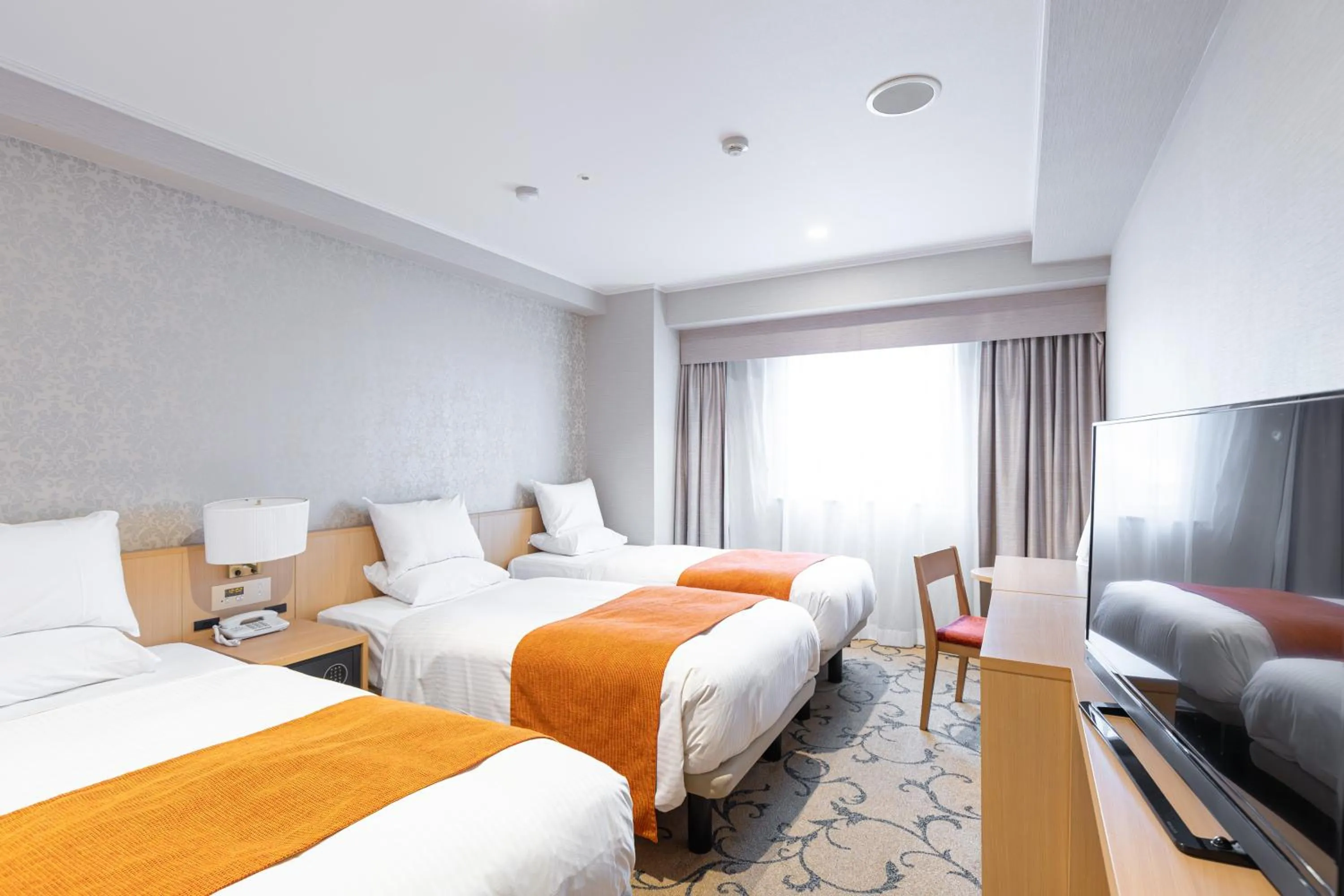 Bed in Hotel Rose Garden Shinjuku