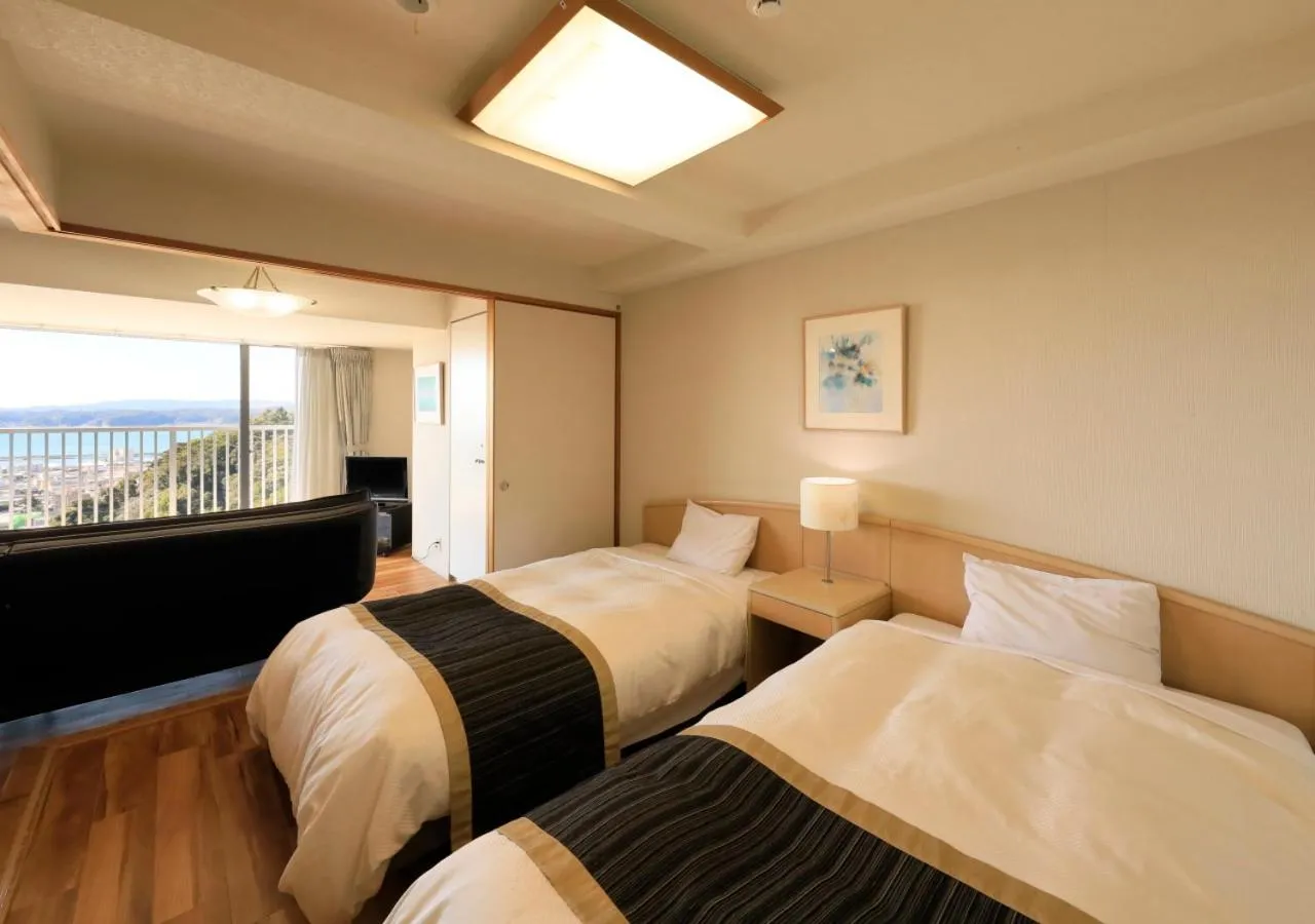 Bed in Katsuura Hilltop Hotel & Residence