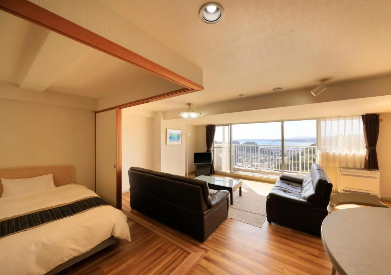 Living room, Bed in Katsuura Hilltop Hotel & Residence