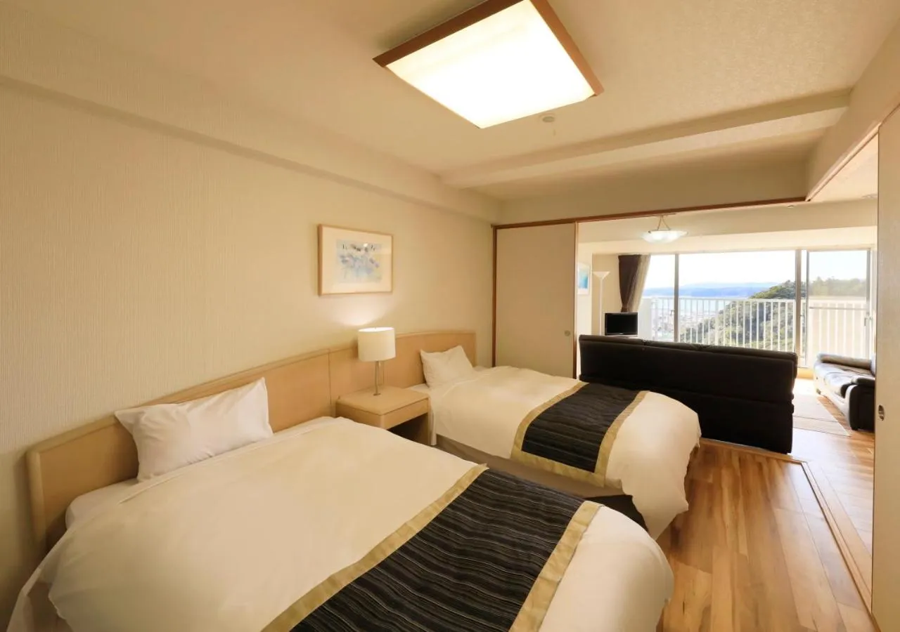 Bed in Katsuura Hilltop Hotel & Residence