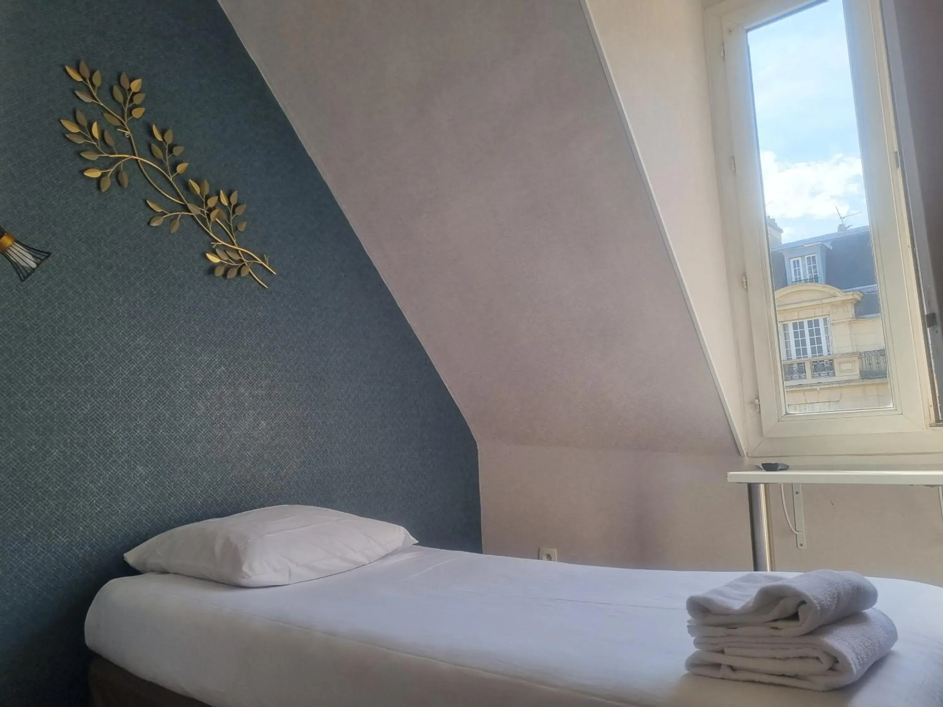 Bed in Hôtel Eiffel Kensington Bed in Hôtel Eiffel Kensington