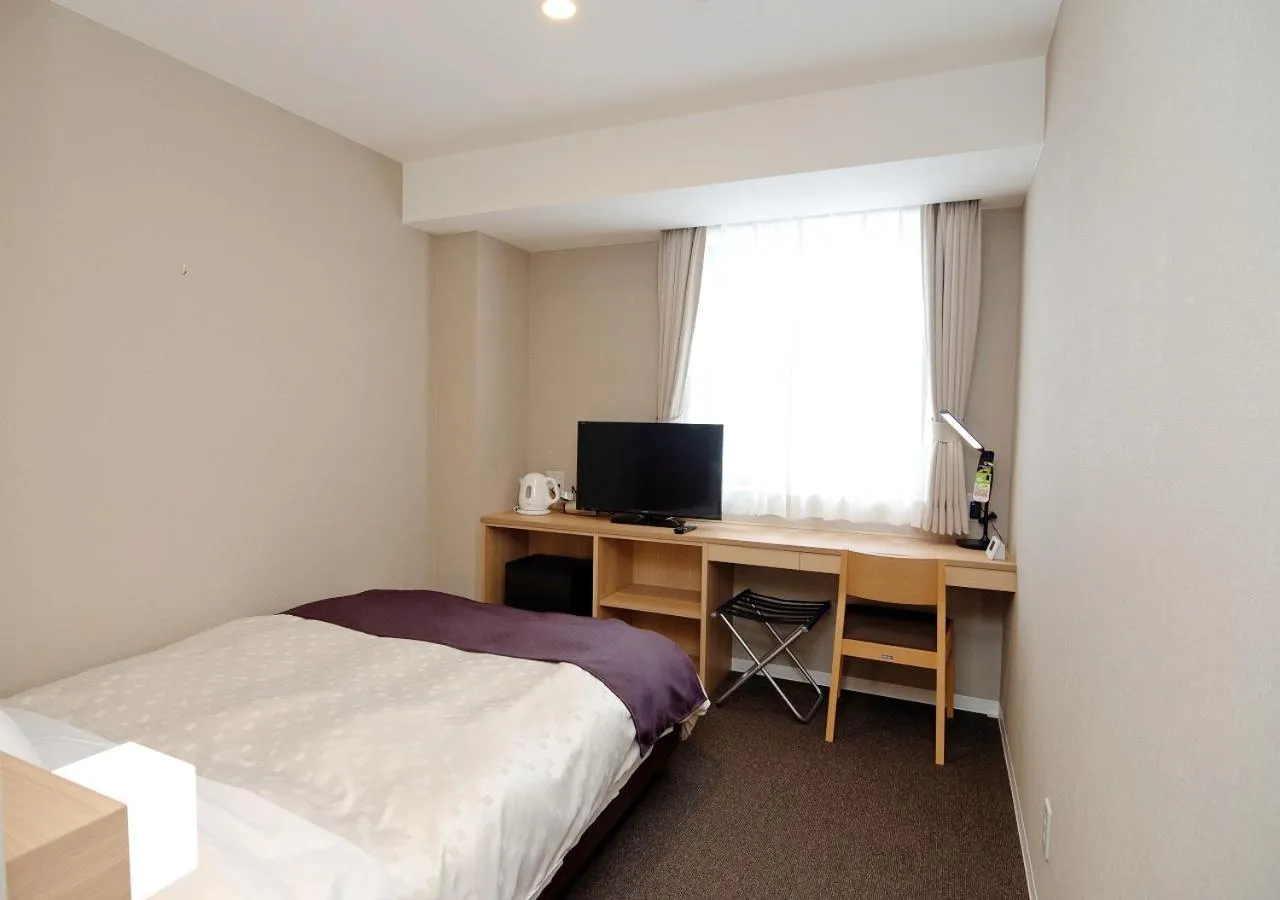 Bed in Shibetsu Grand Hotel