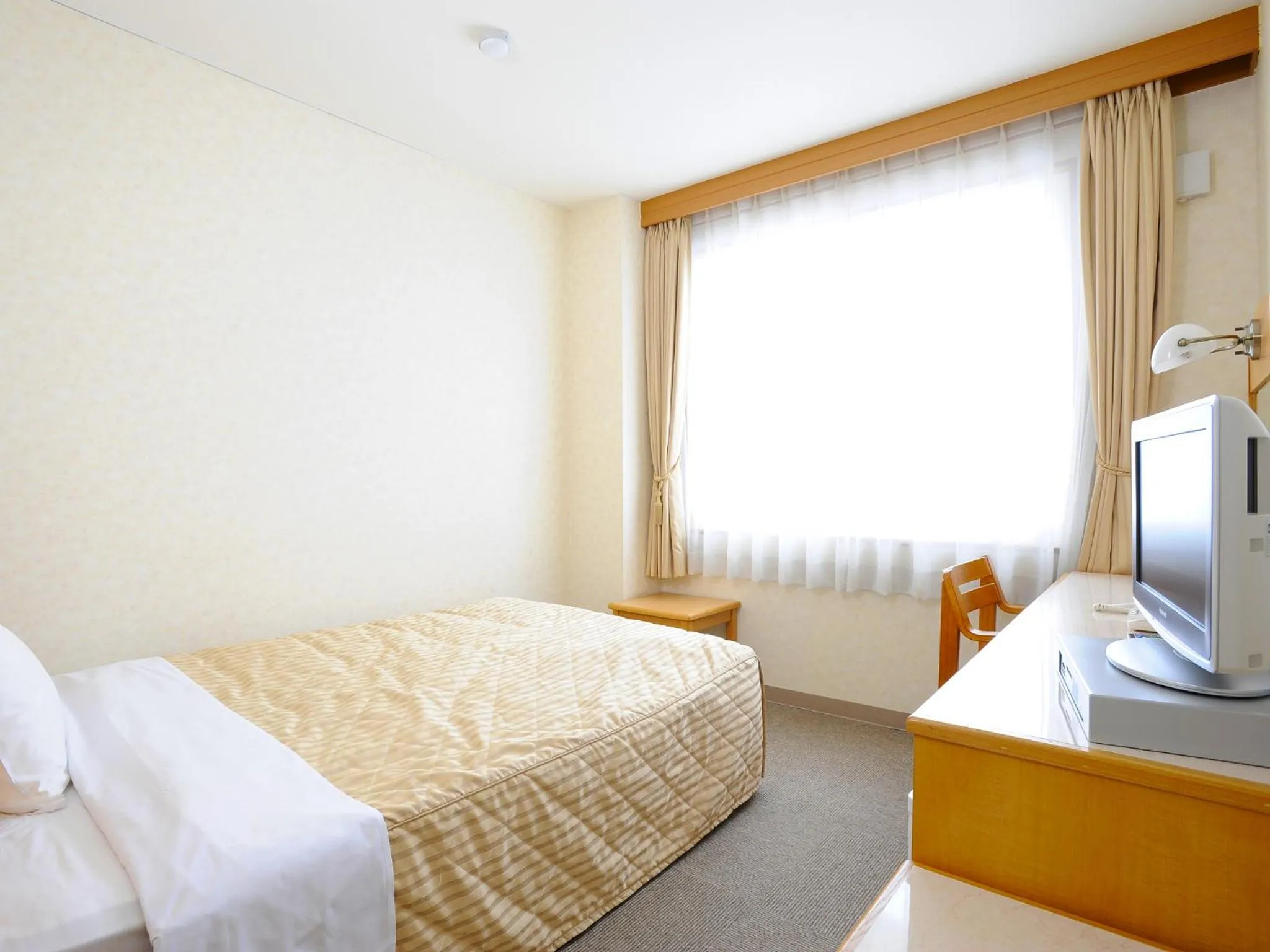 Bed in Shibetsu Grand Hotel