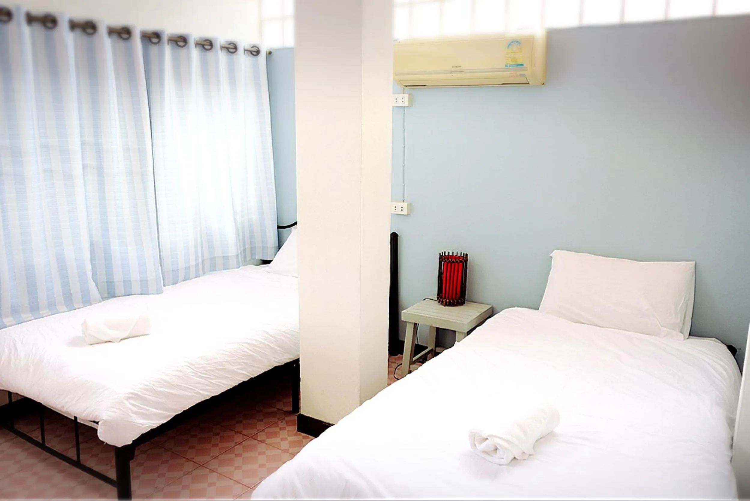 Bed in Yen Aura Boutique Hotel