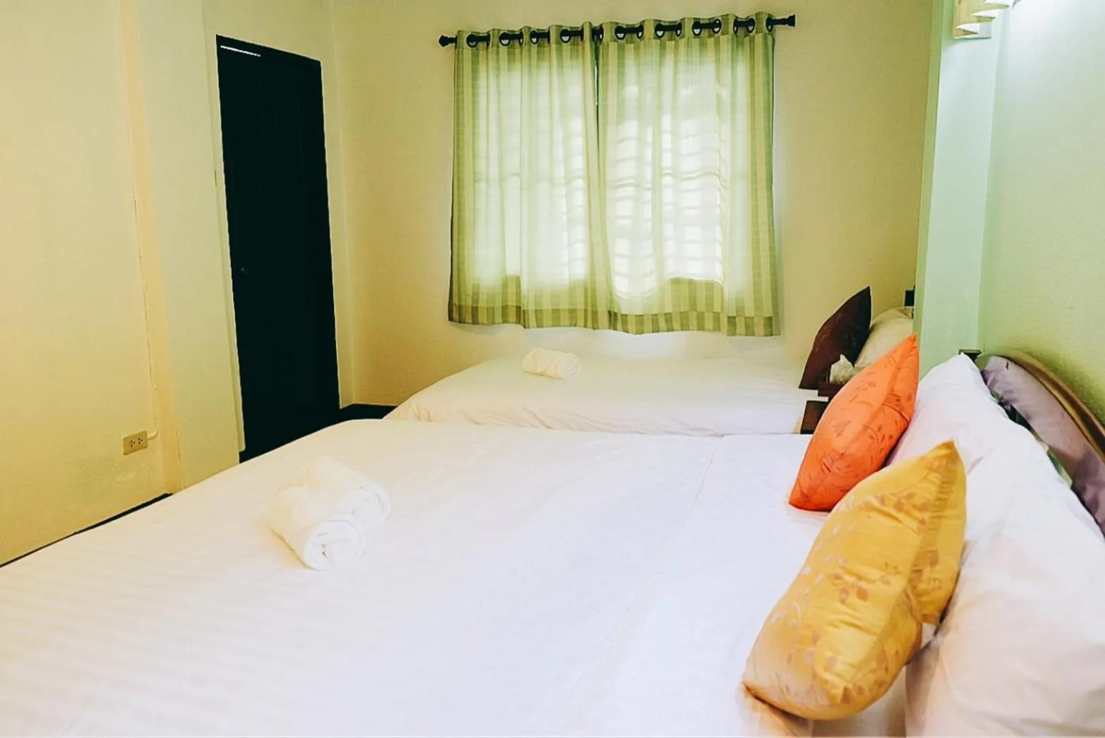 Bed in Yen Aura Boutique Hotel