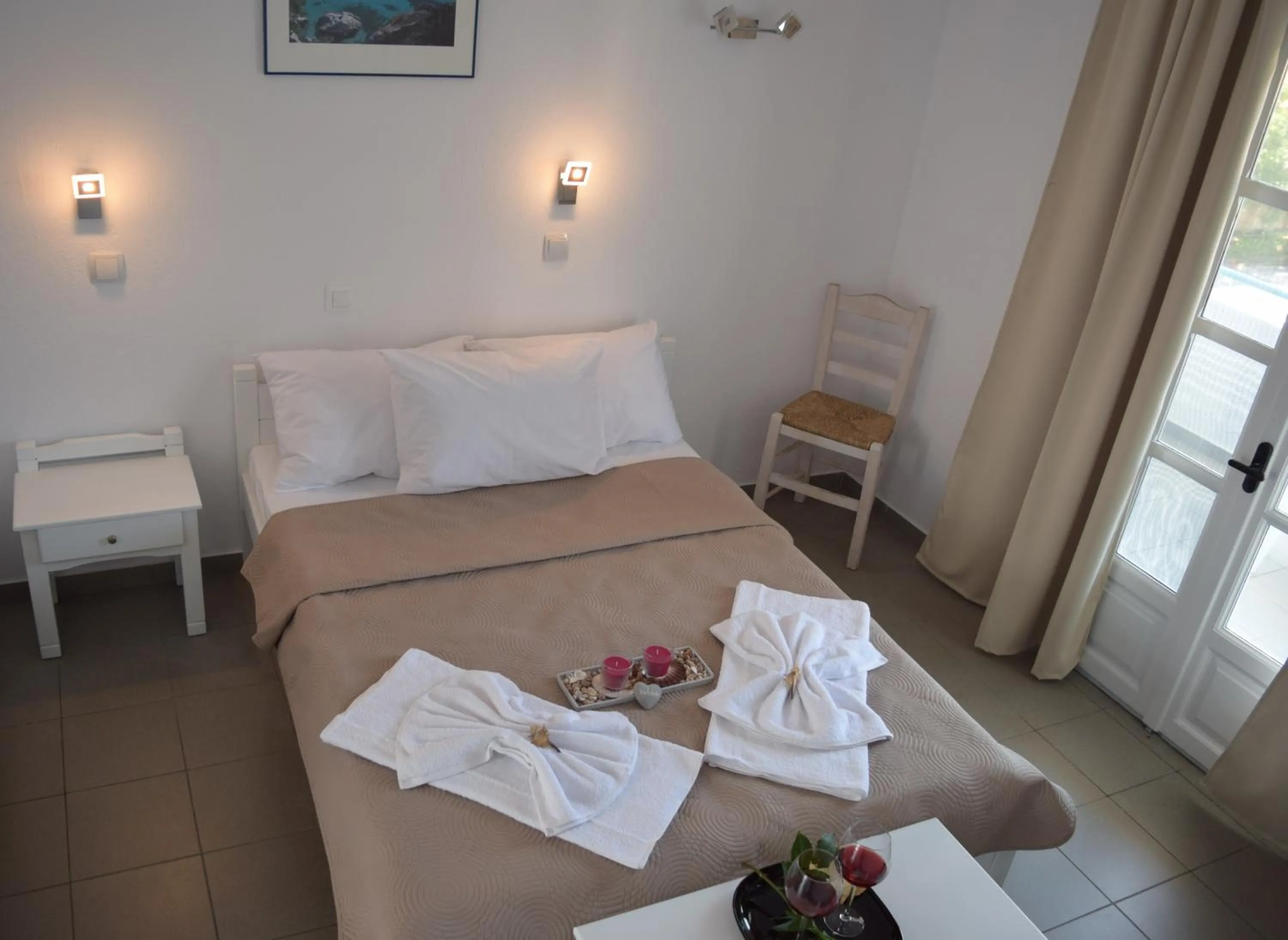 towels, Bed in Astri Hotel