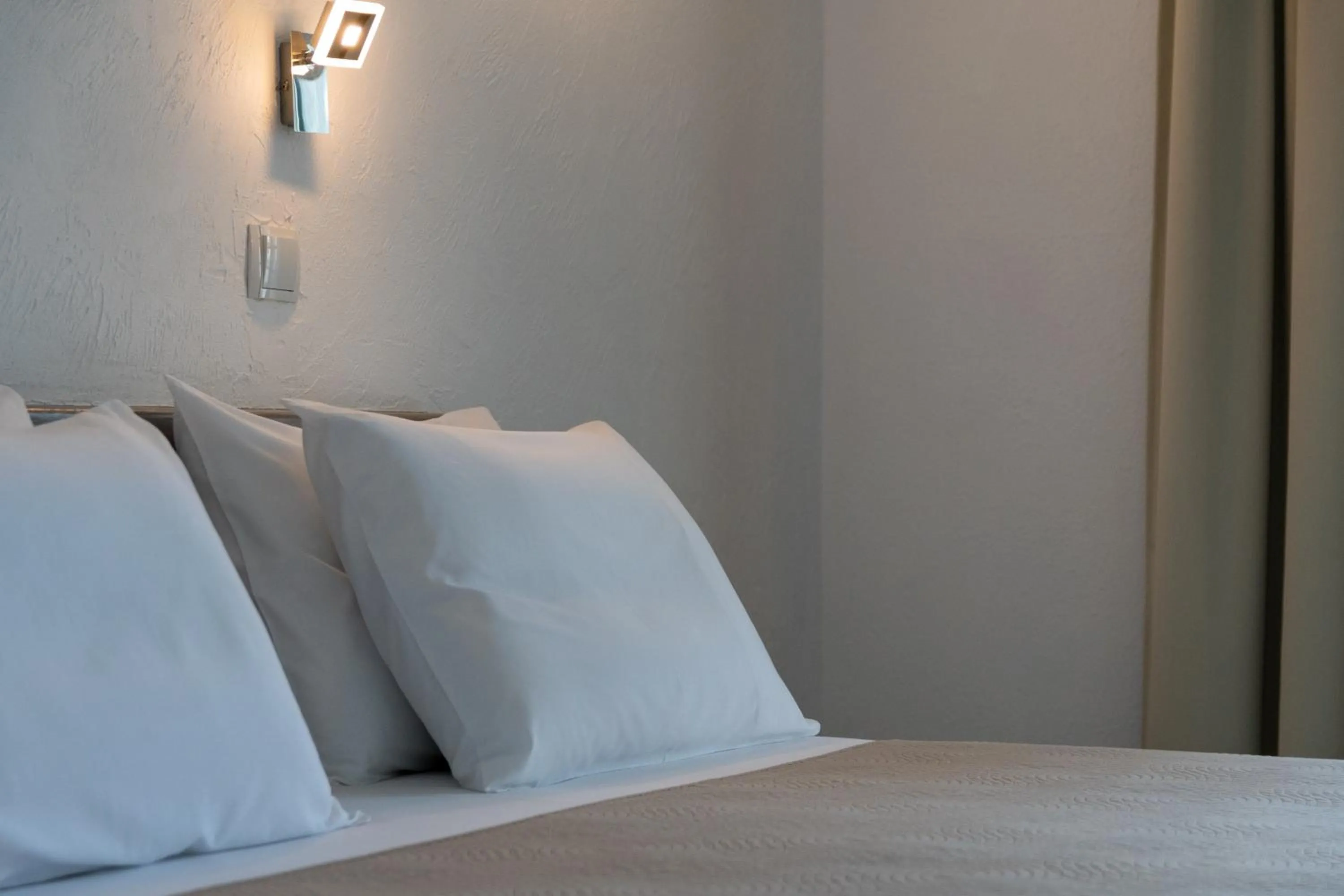 Bed in Astri Hotel