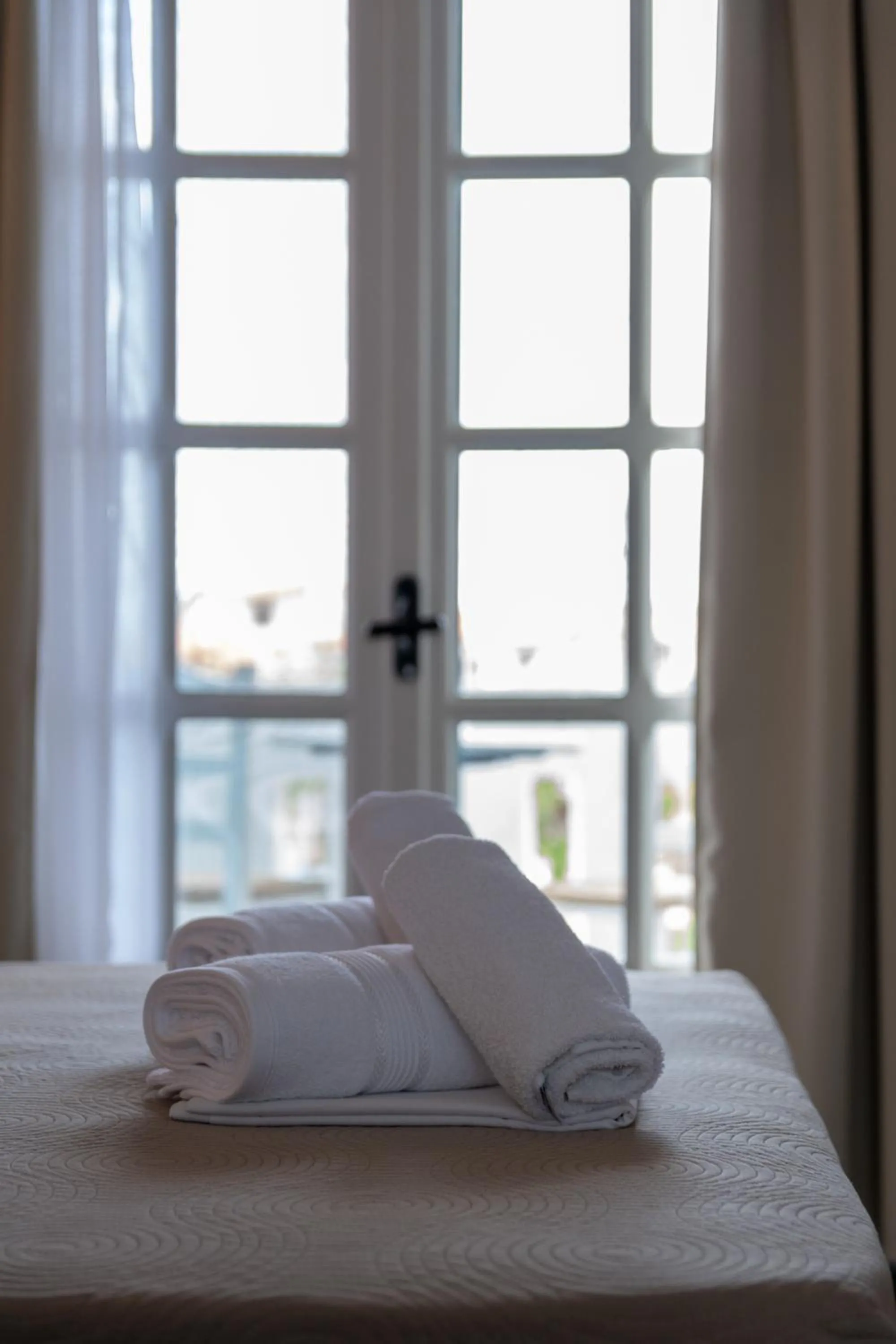 Bed in Astri Hotel