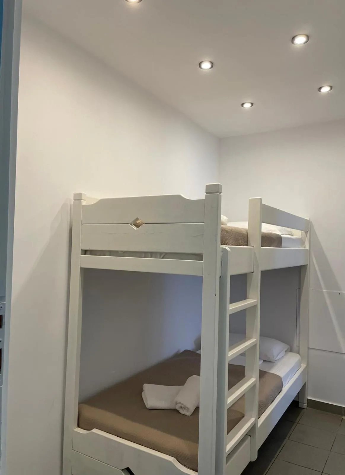 Bed in Astri Hotel
