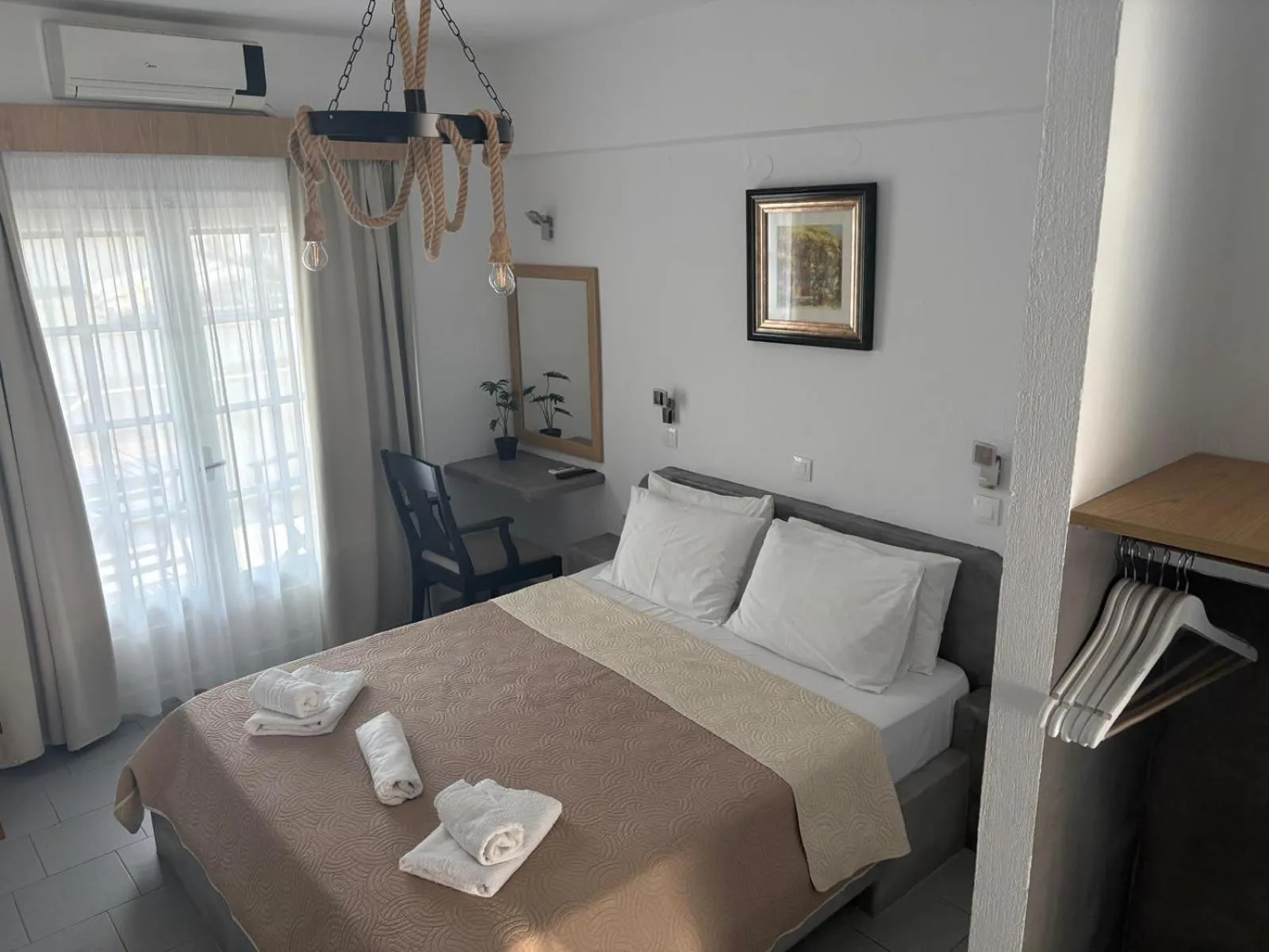 Bed in Astri Hotel