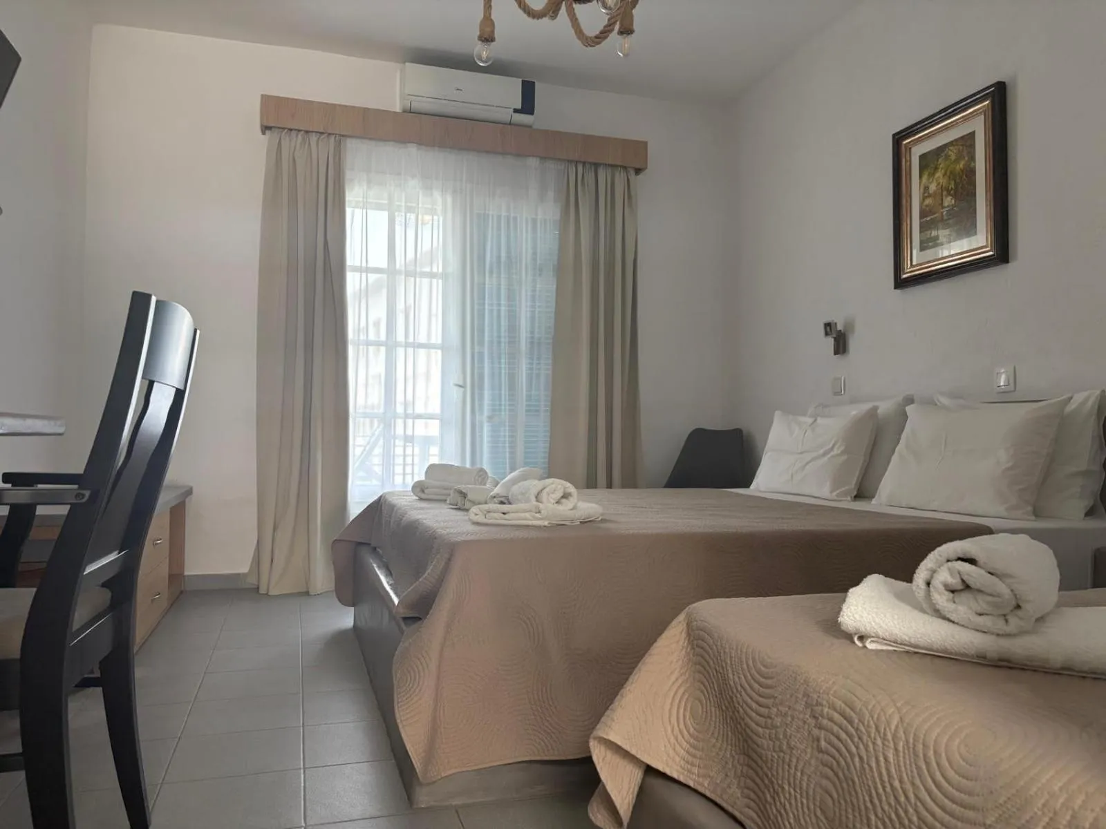 Bed in Astri Hotel