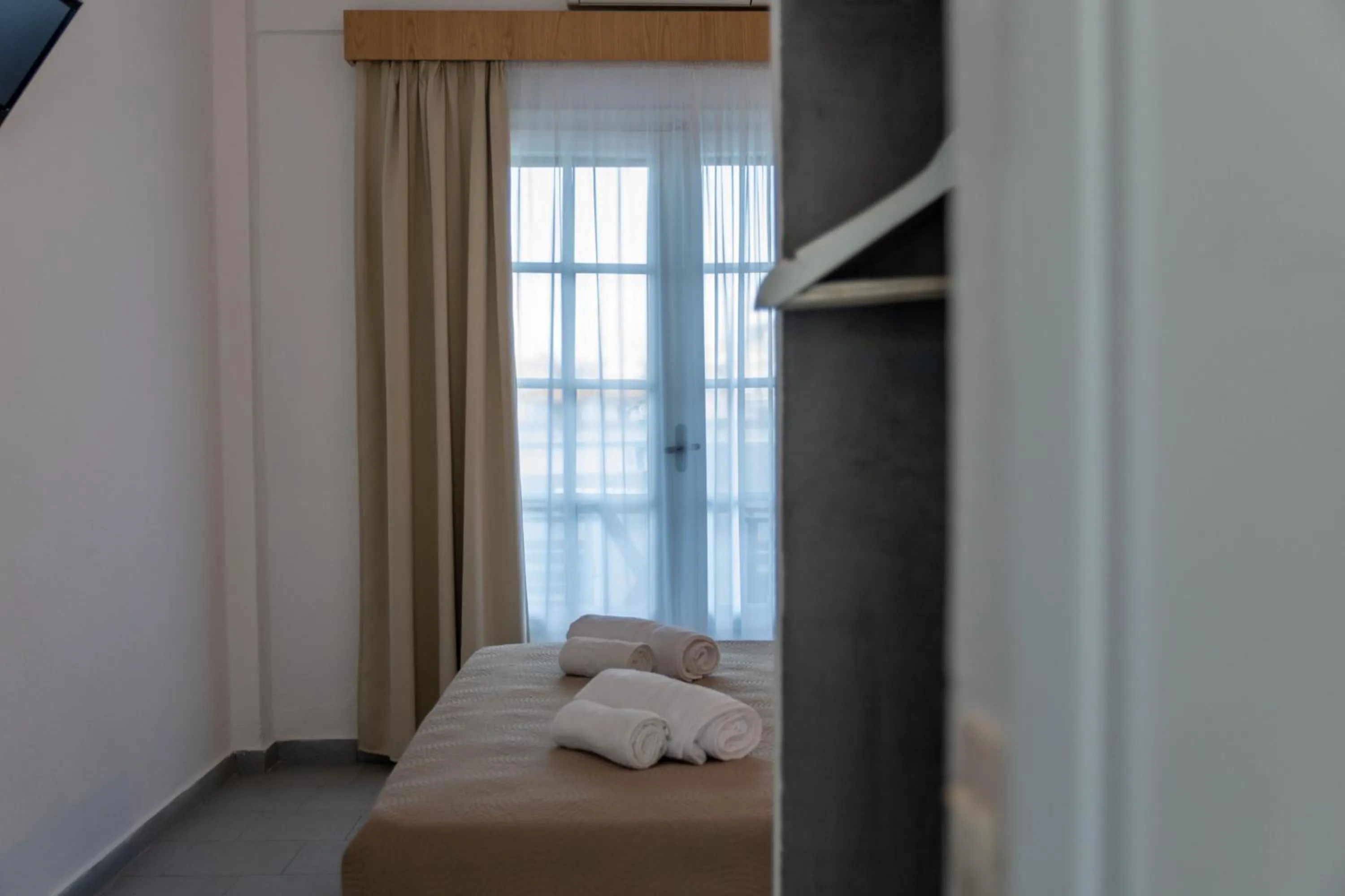 Bed in Astri Hotel