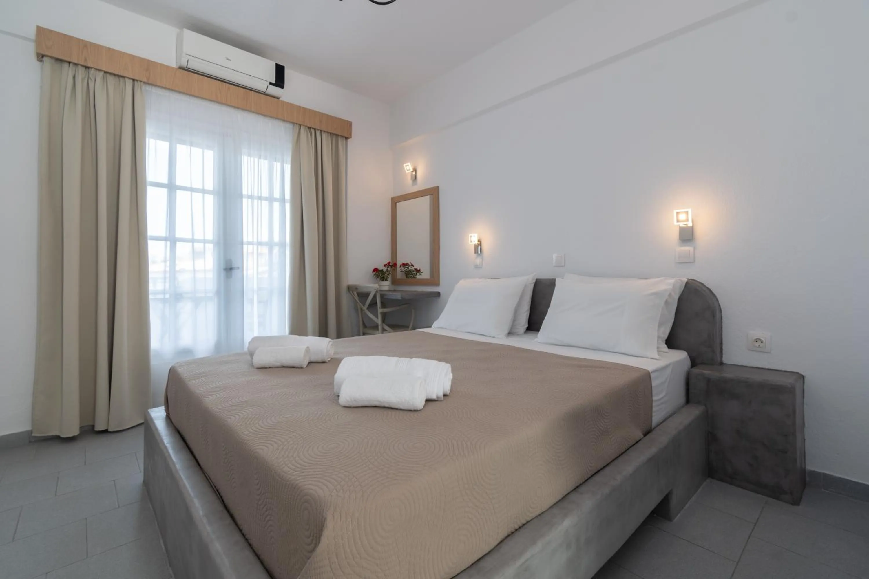 Bed in Astri Hotel