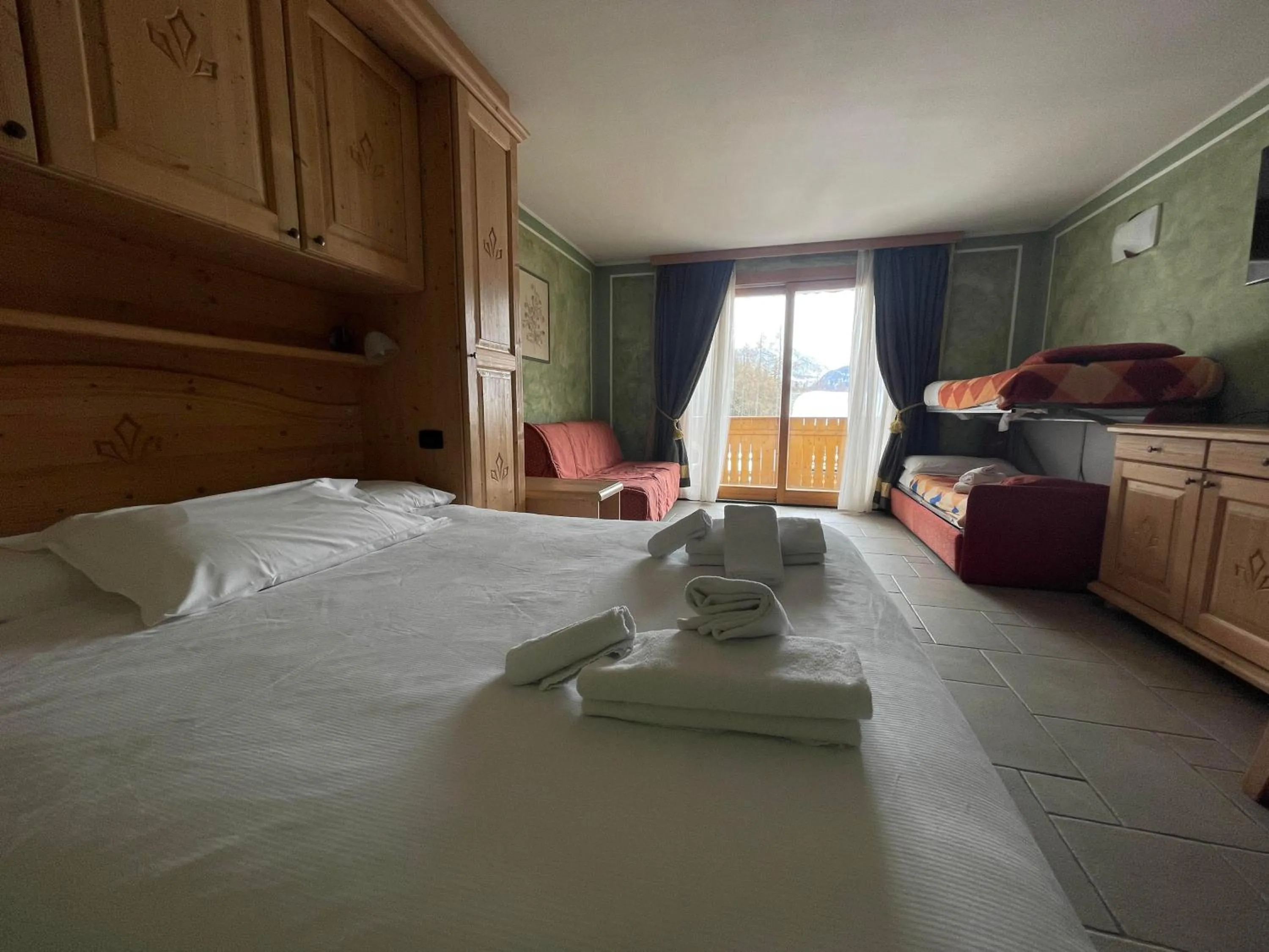 Bed in Boscone Suite Hotel