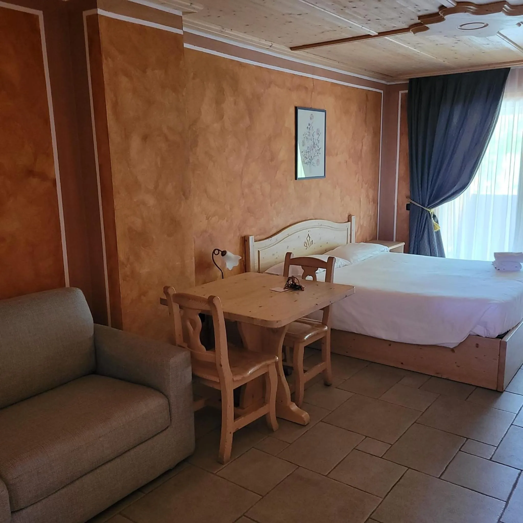 Bed in Boscone Suite Hotel