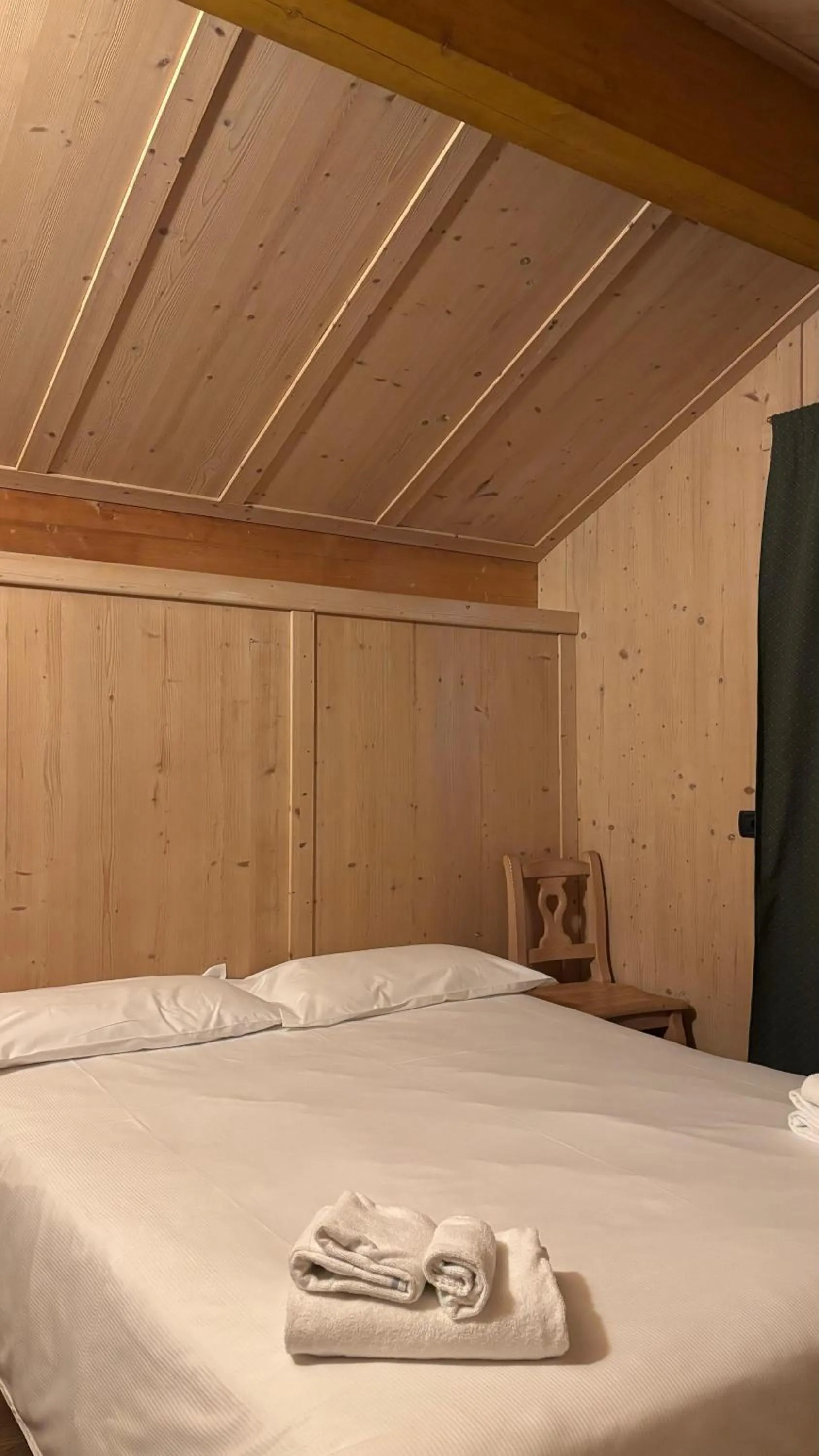 Bed in Boscone Suite Hotel