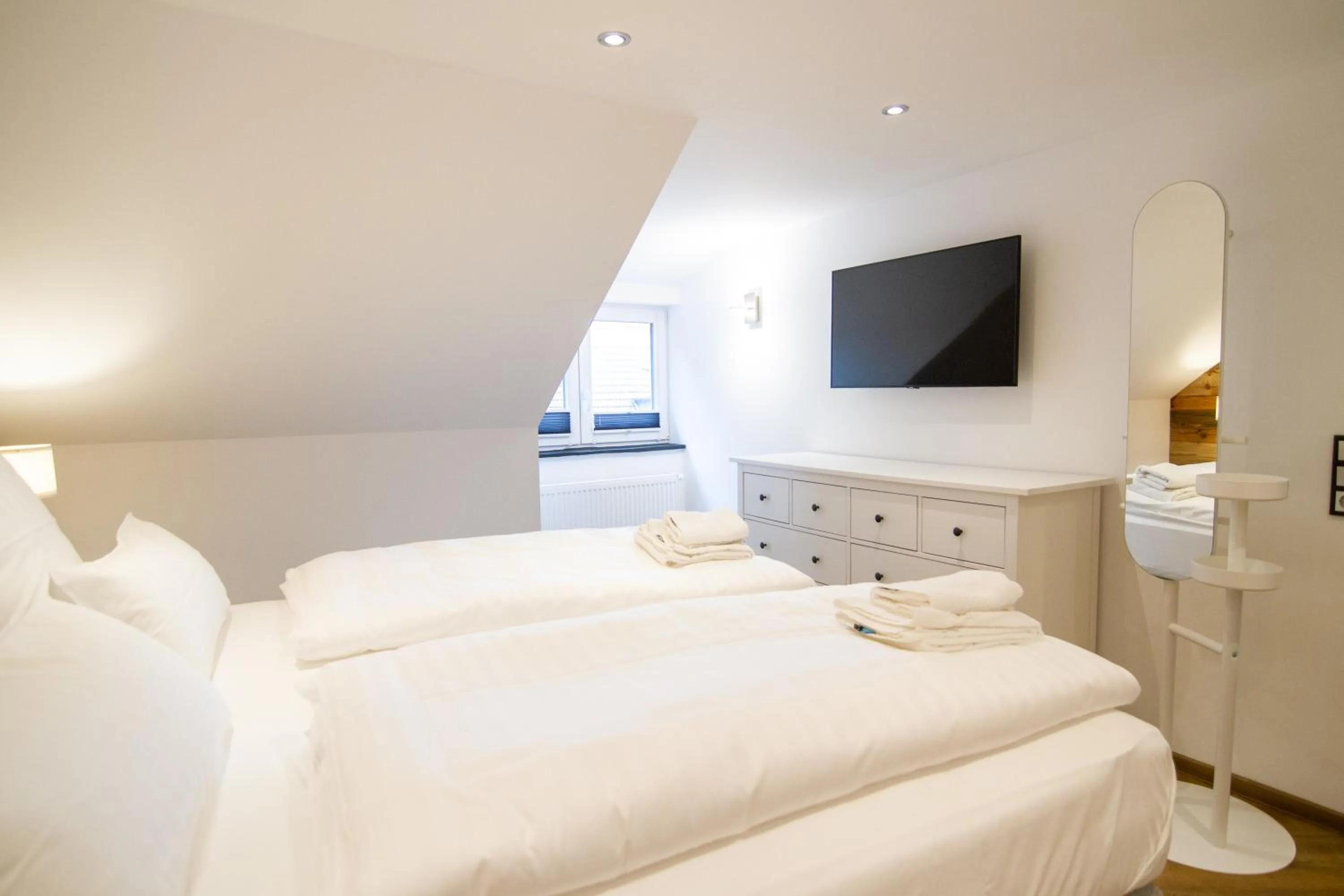 Bed in Schiefer Suite Hotel & Apartments