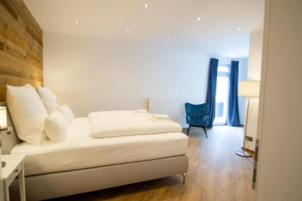 Bed in Schiefer Suite Hotel & Apartments