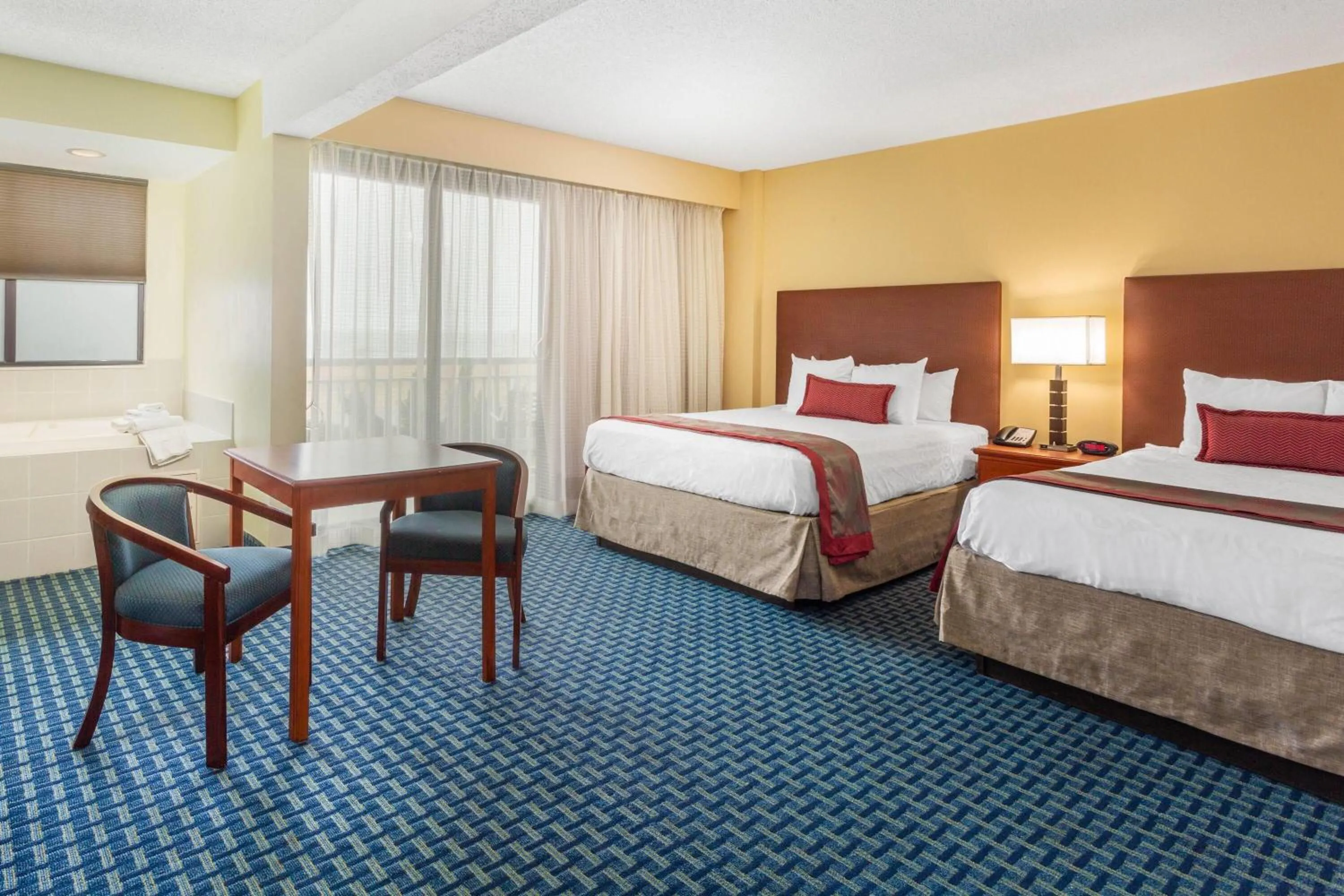 Photo of the whole room, Bed in Ramada Plaza by Wyndham Virginia Beach Oceanfront