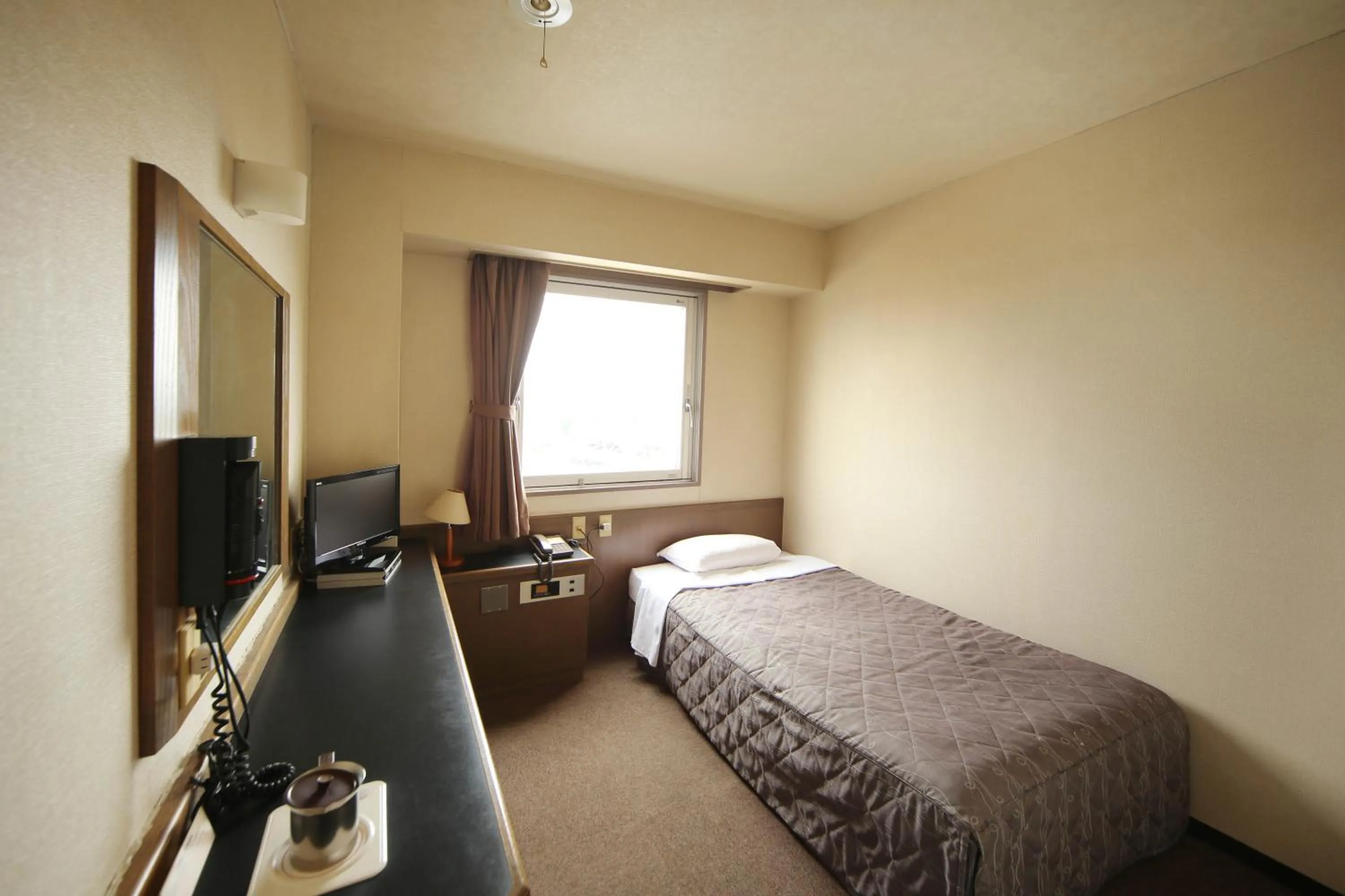 Bed in Isesaki Harvest Hotel